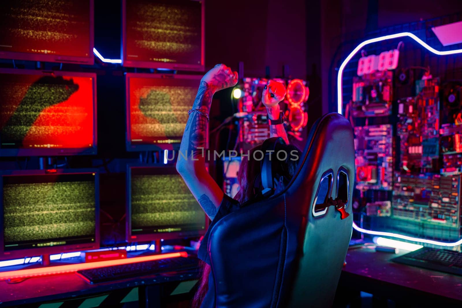 Winner. Happy young gamer plays online video games computer she raises hands to wins tournament, young woman people in gaming headphones playing video game online at home feel excited, E-Sport concept