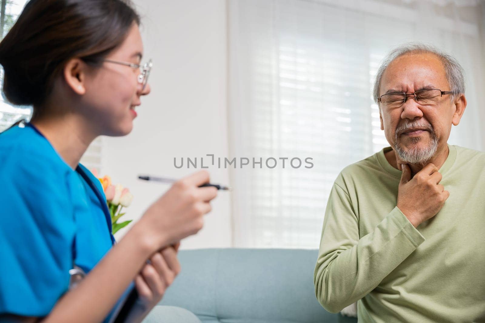 Doctor woman examines lymph nodes on elderly neck to determine if swollen, sore throat, Asian young nurse checking senior old man neck pain in clinic at retirement home, physical therapist