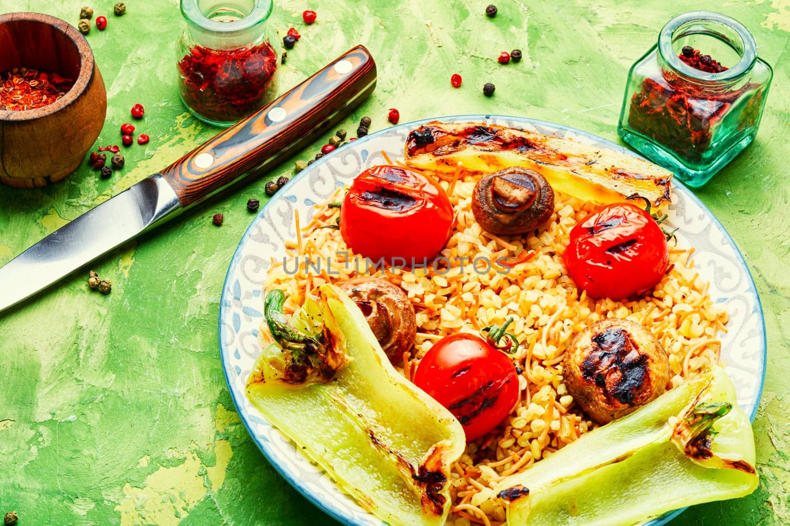 Roasted tomato, fried bell pepper and grilled mushroom lunch with rice for garnish