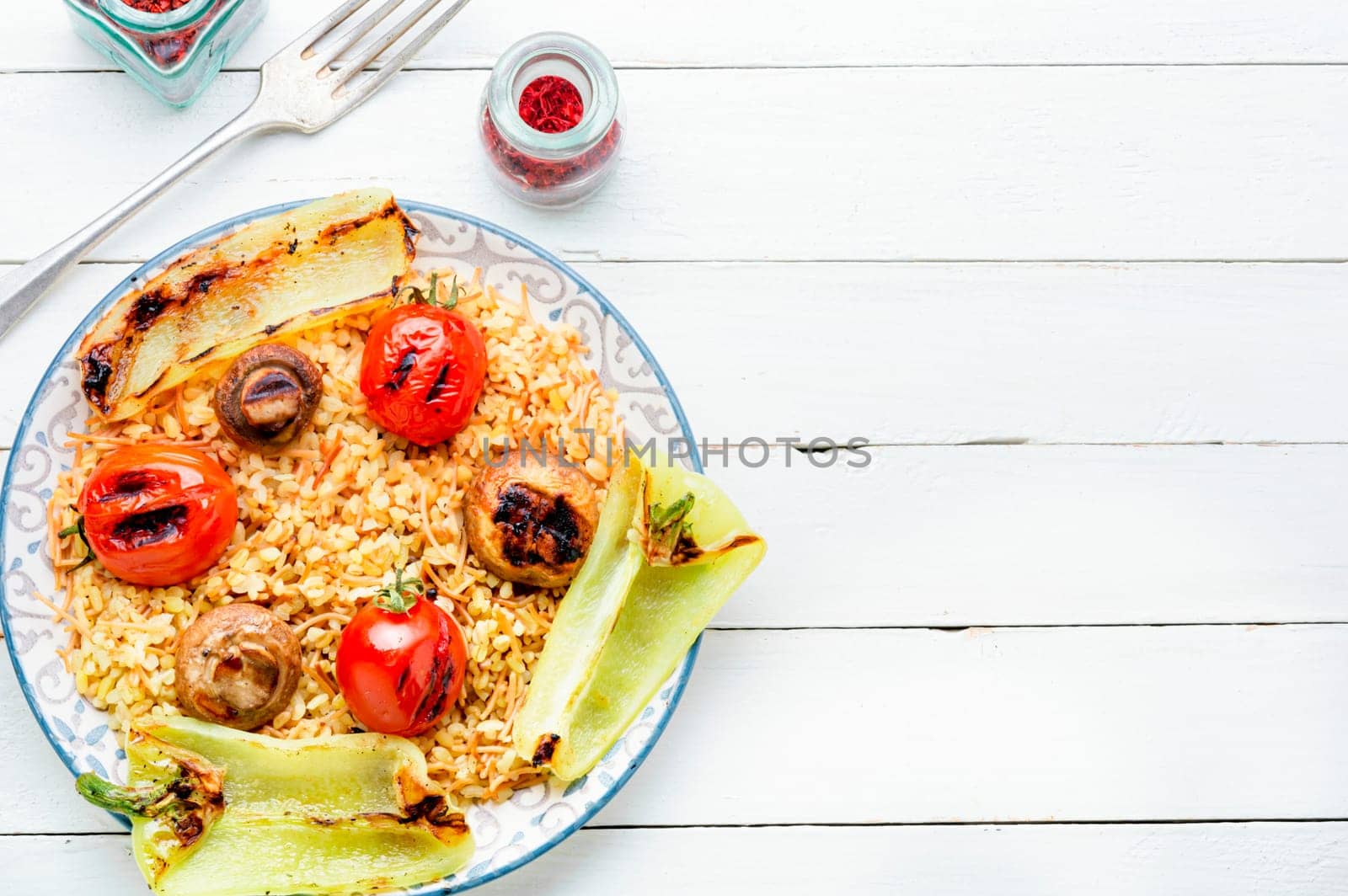 Grilled tomato, pepper and grilled mushroom lunch with rice .Top view with copy space.