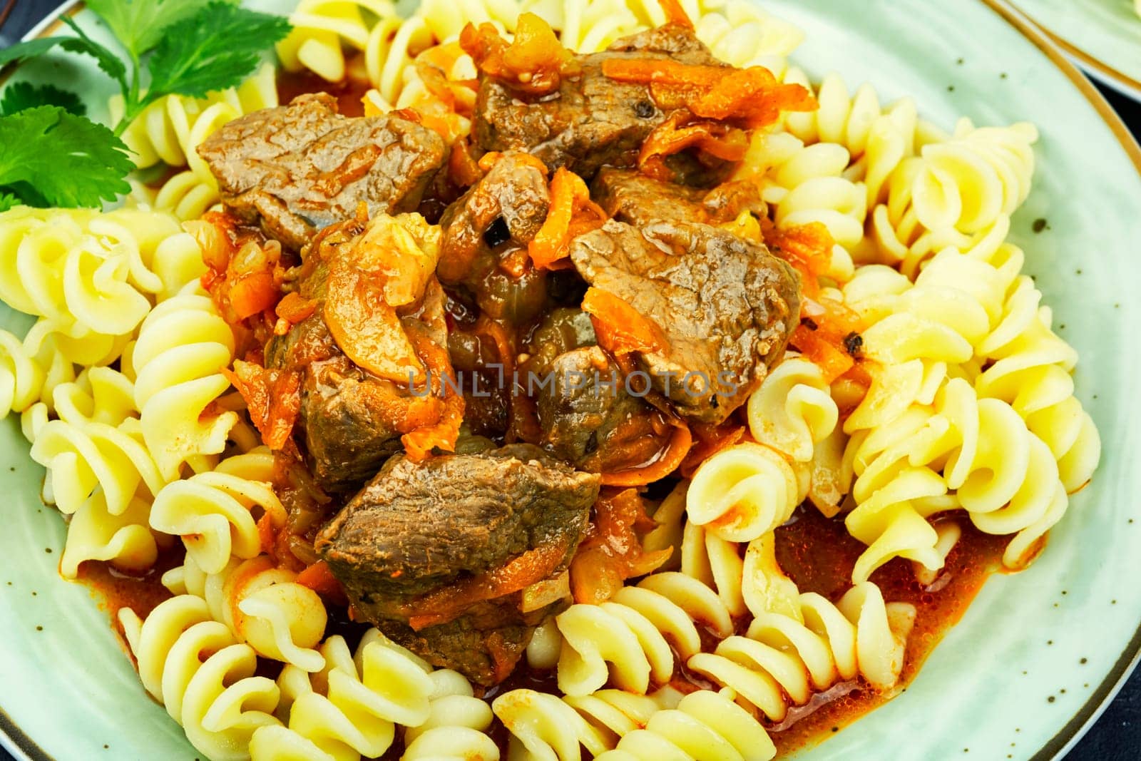 Delicious Beef goulash with pasta. Meat dish. Homemade recipe.