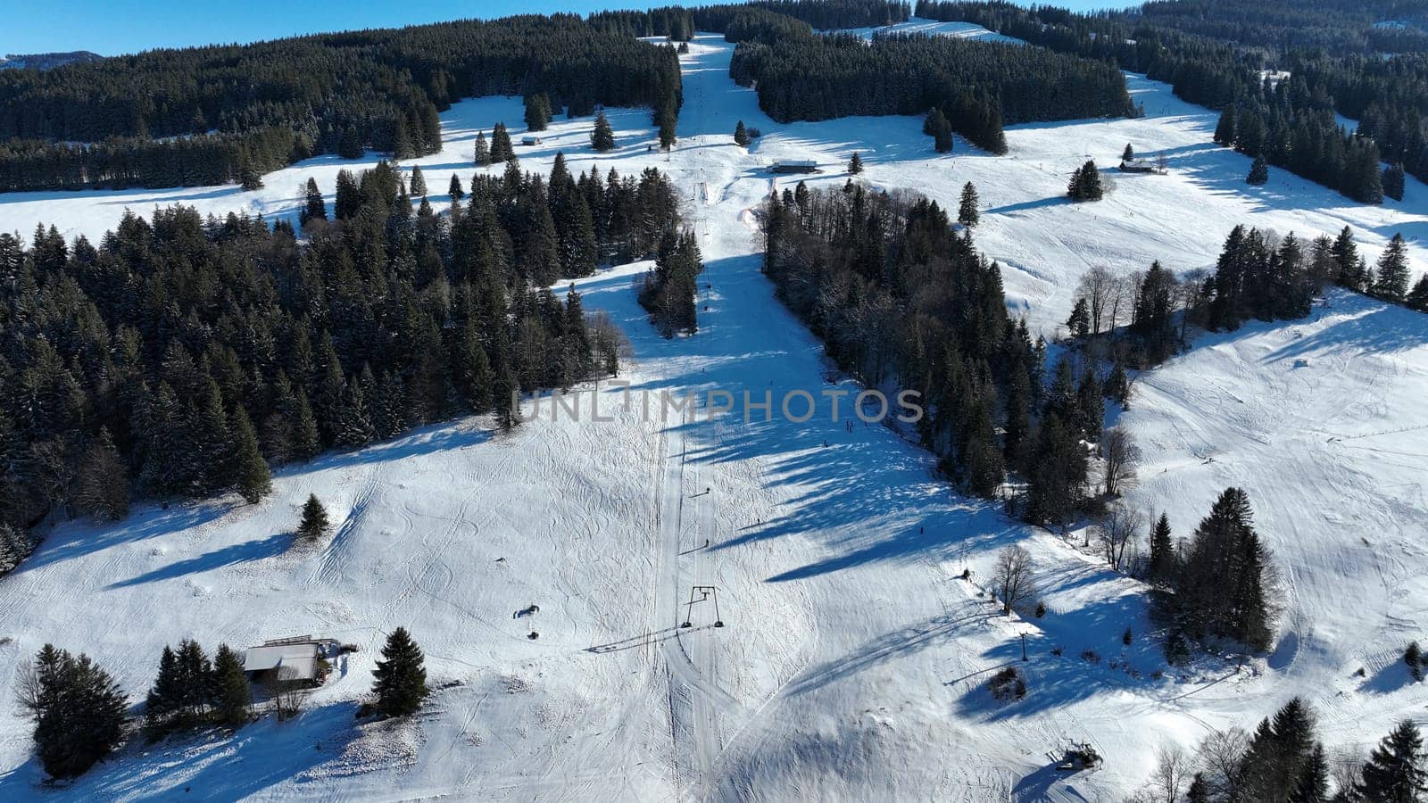 Aerial shot with a drone of a ski lift in Bavaria. Skiing in winter