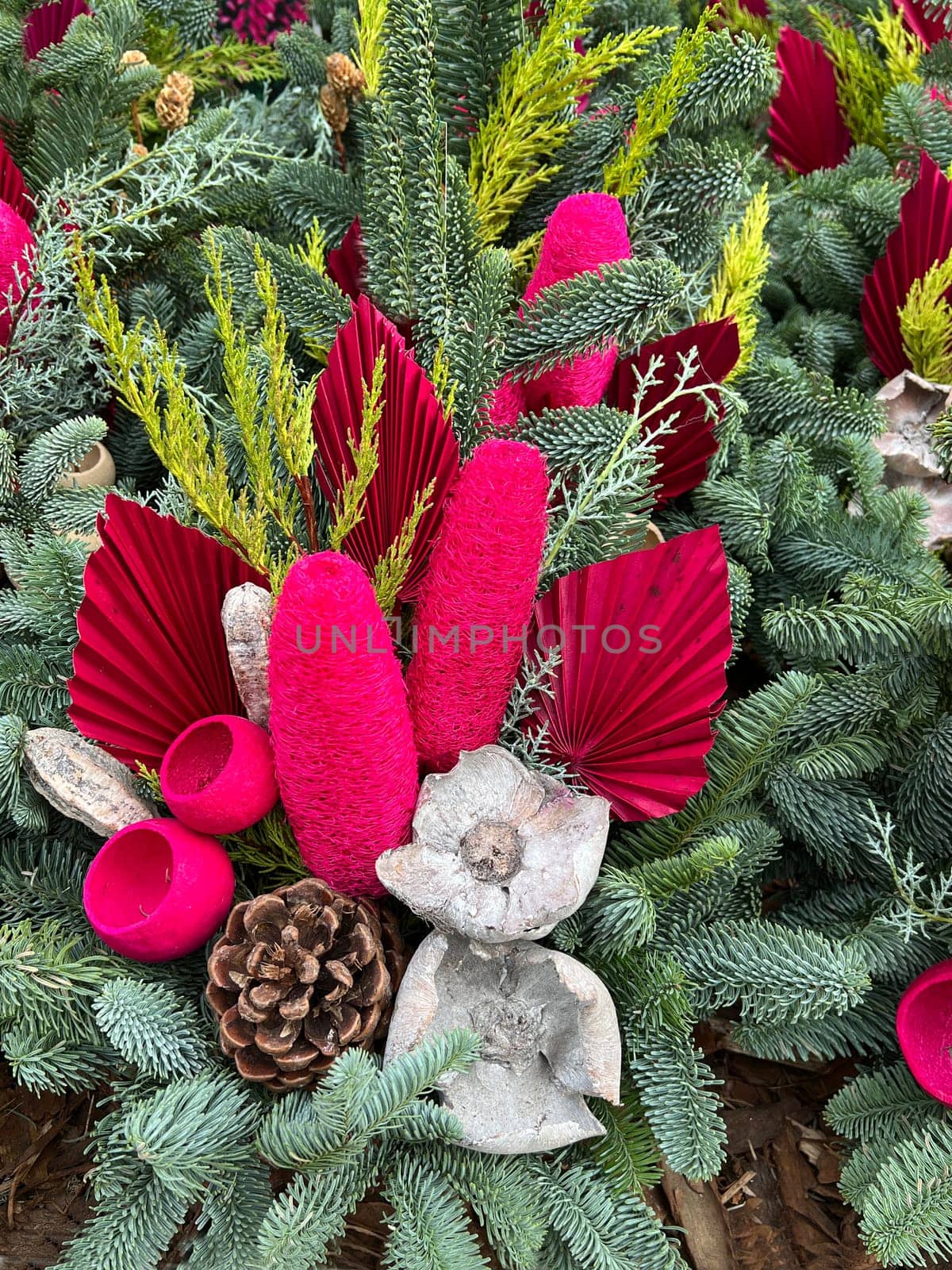 Grave arrangements are placed on the graves in remembrance. Grave arrangements are placed on the graves to commemorate them.