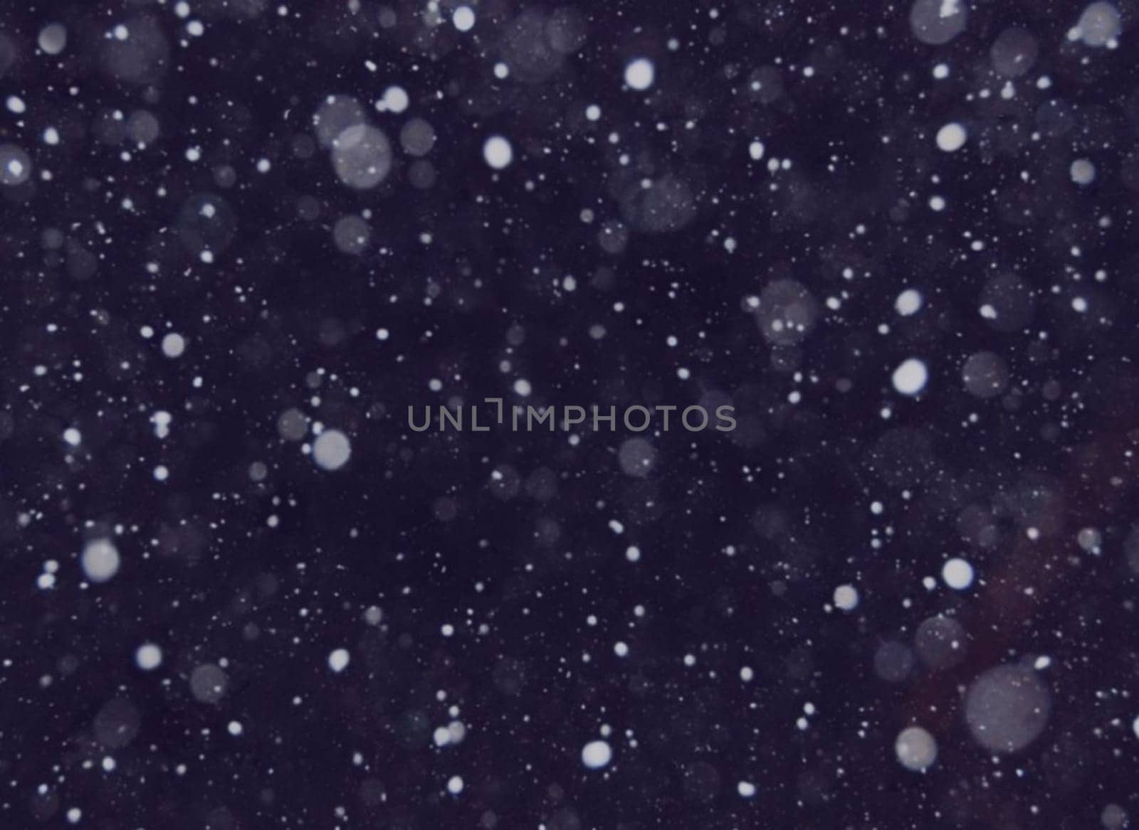 Purple or violet tone blur bokeh light. Defocused background. New year christmas bokeh.