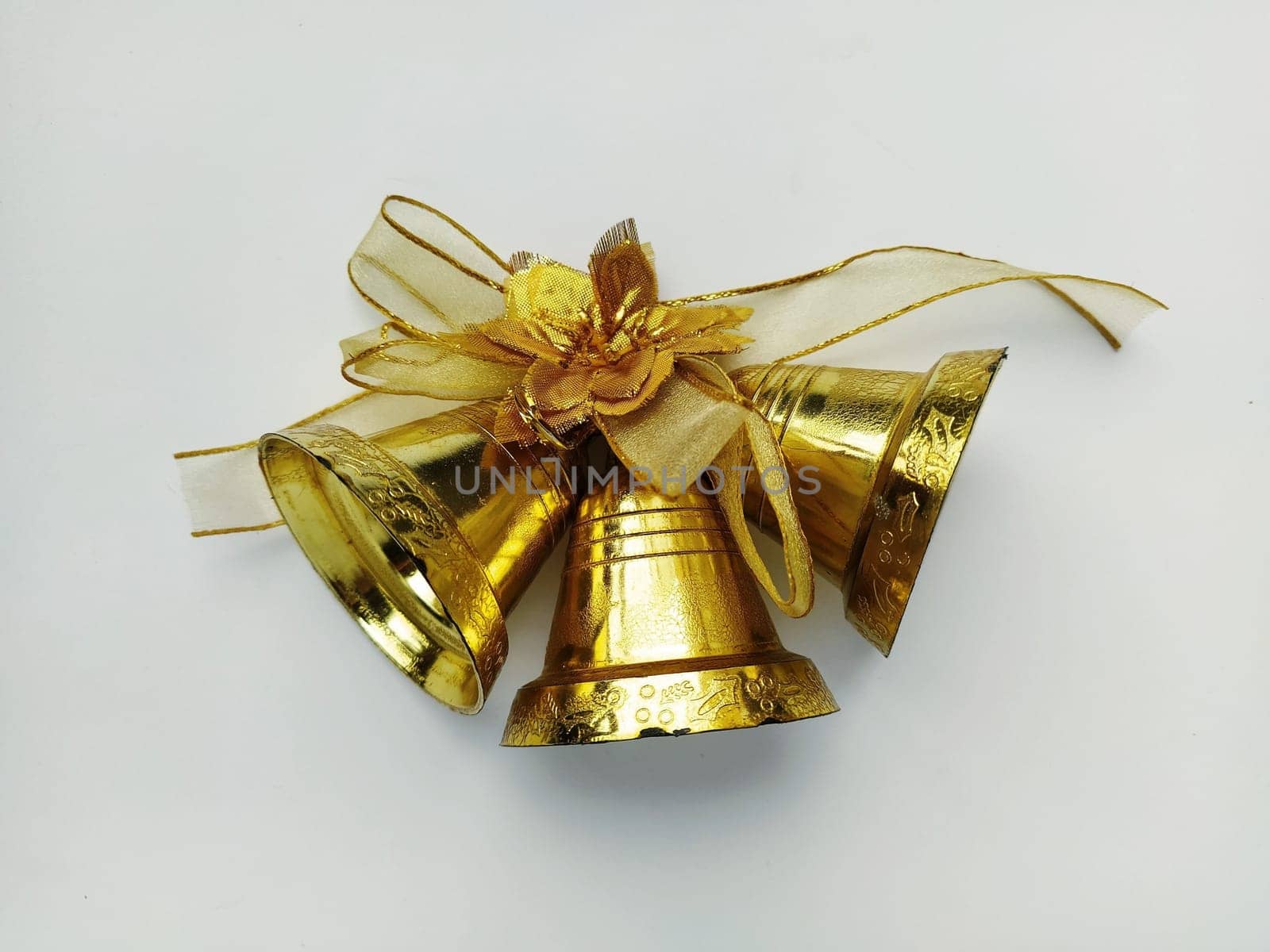 Christmas bells isolated on white background. Golden decoration for New Year or Christmas.