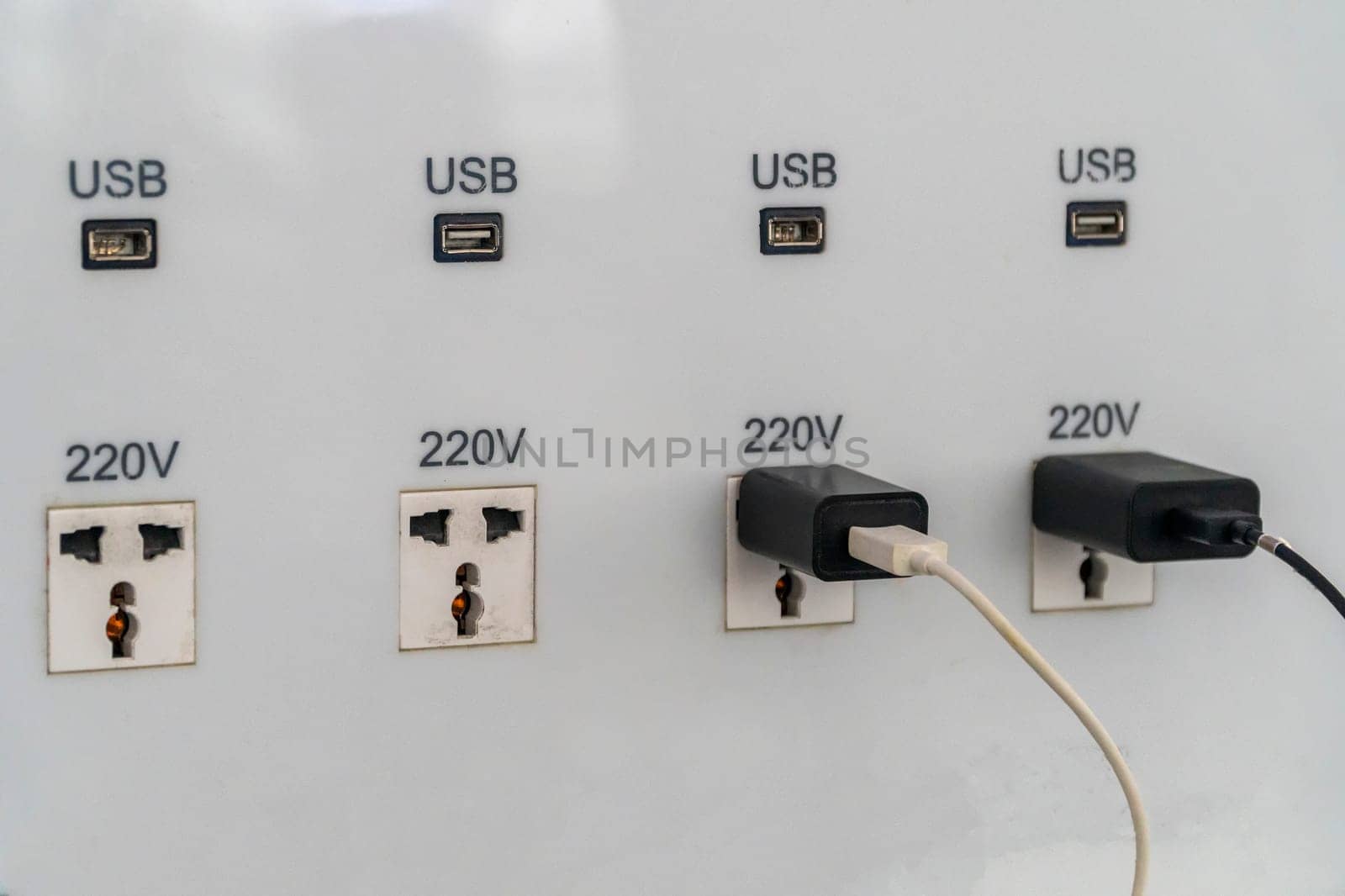 USB slot is attached to the wall for charging.