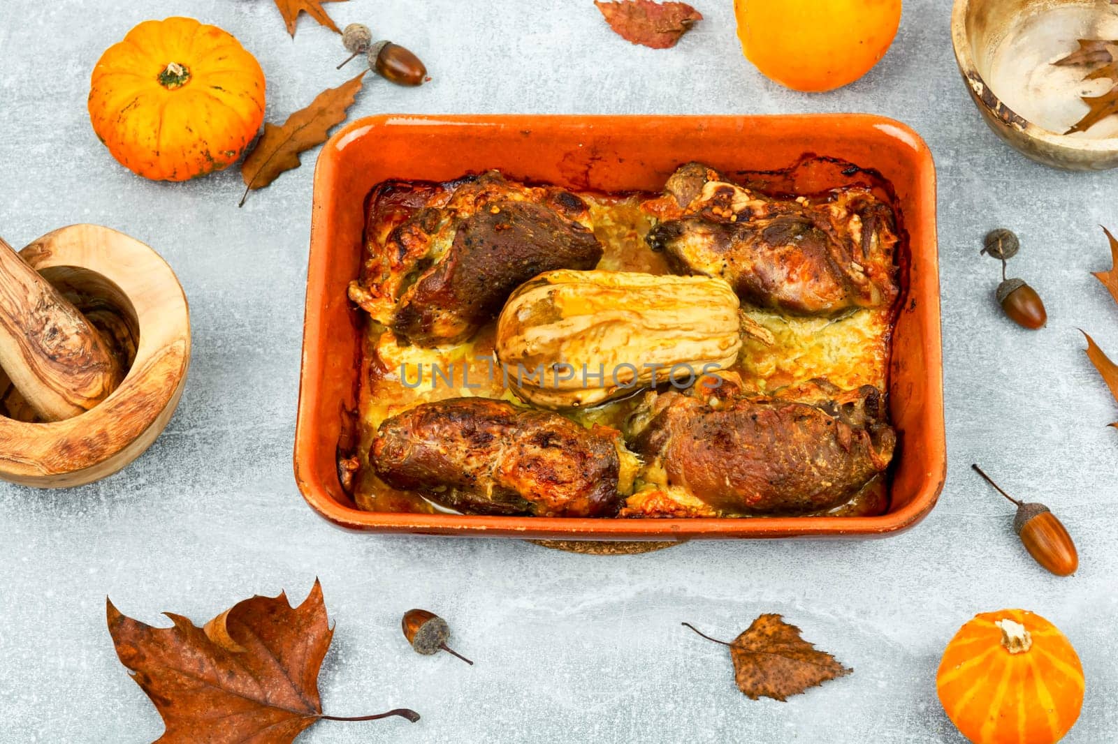 Appetizing baked meat rolls stuffed with pumpkin. Autumn recipe.
