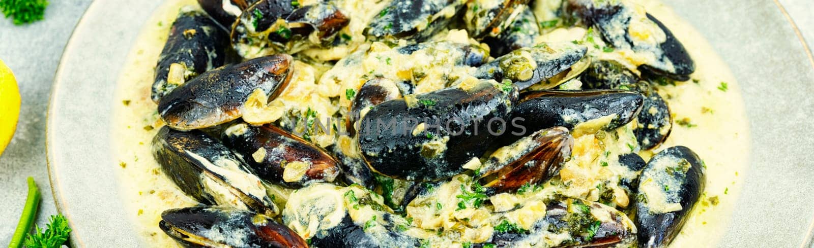 Cooked appetizing mussels in a creamy sauce