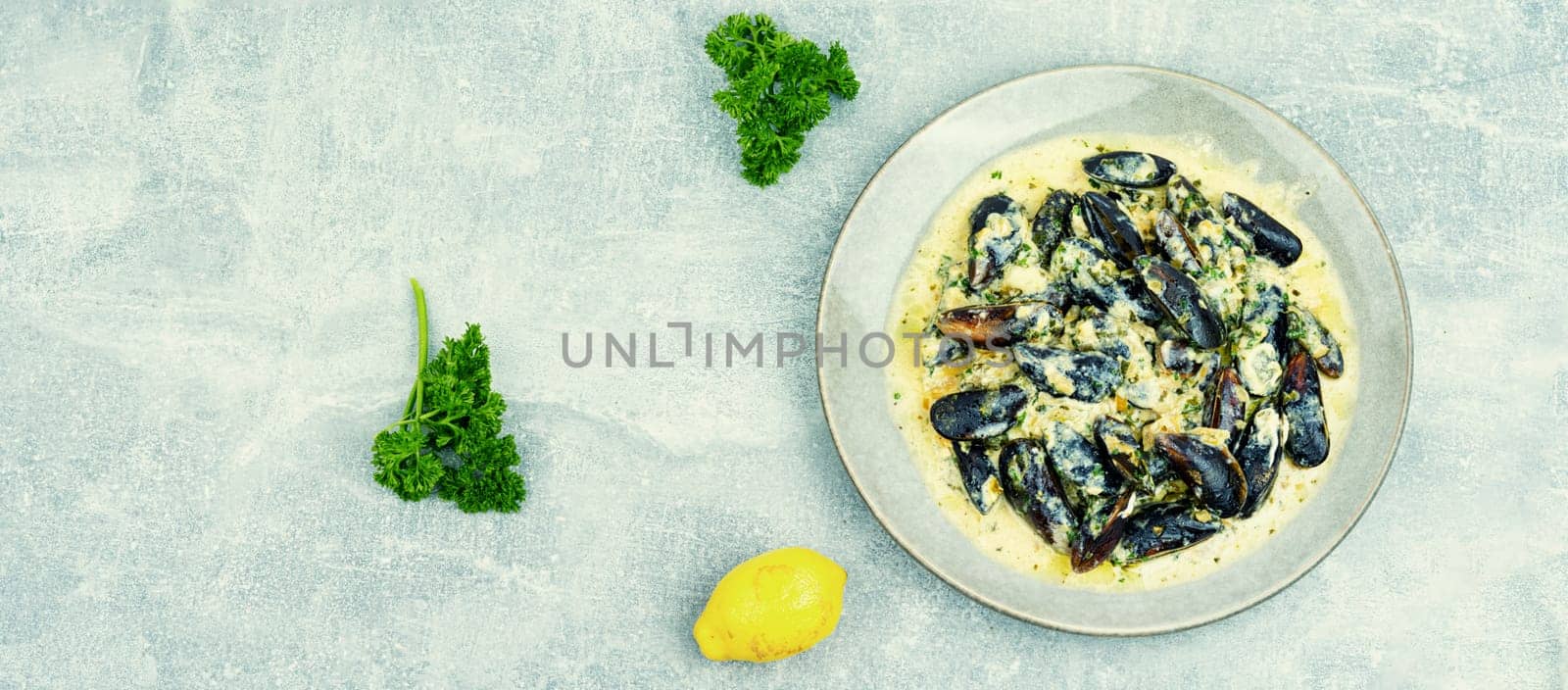Cooked appetizing mussels in a creamy sauce
