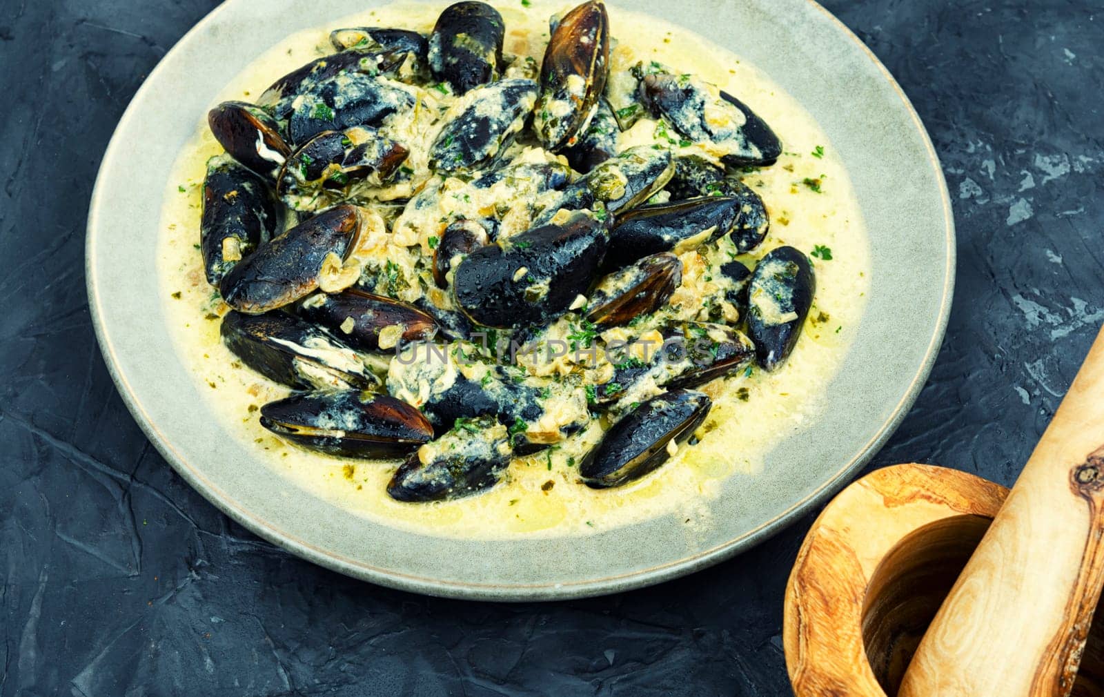 Cooked appetizing mussels in a creamy sauce
