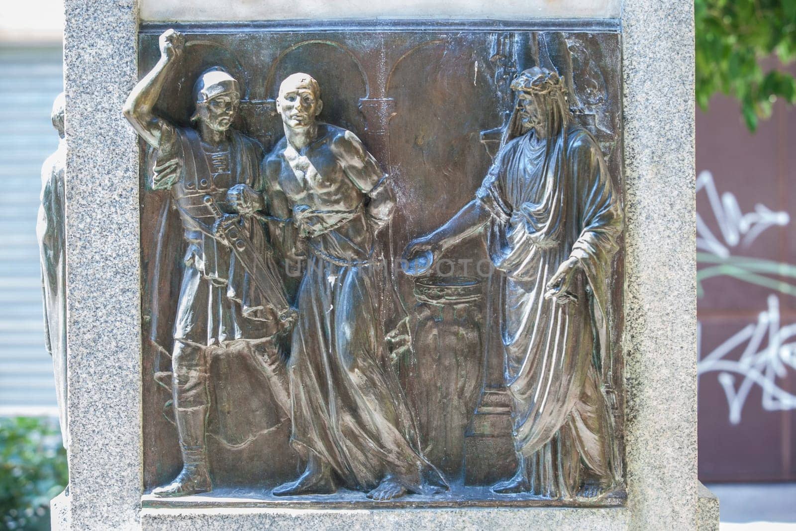 Cordoba, Spain - Sept 8th, 2020: Monument of Bishop Osio, sculptor Lorenzo Coullaut Valera, 1926. Cordoba, Spain. Biography bas-reliefs