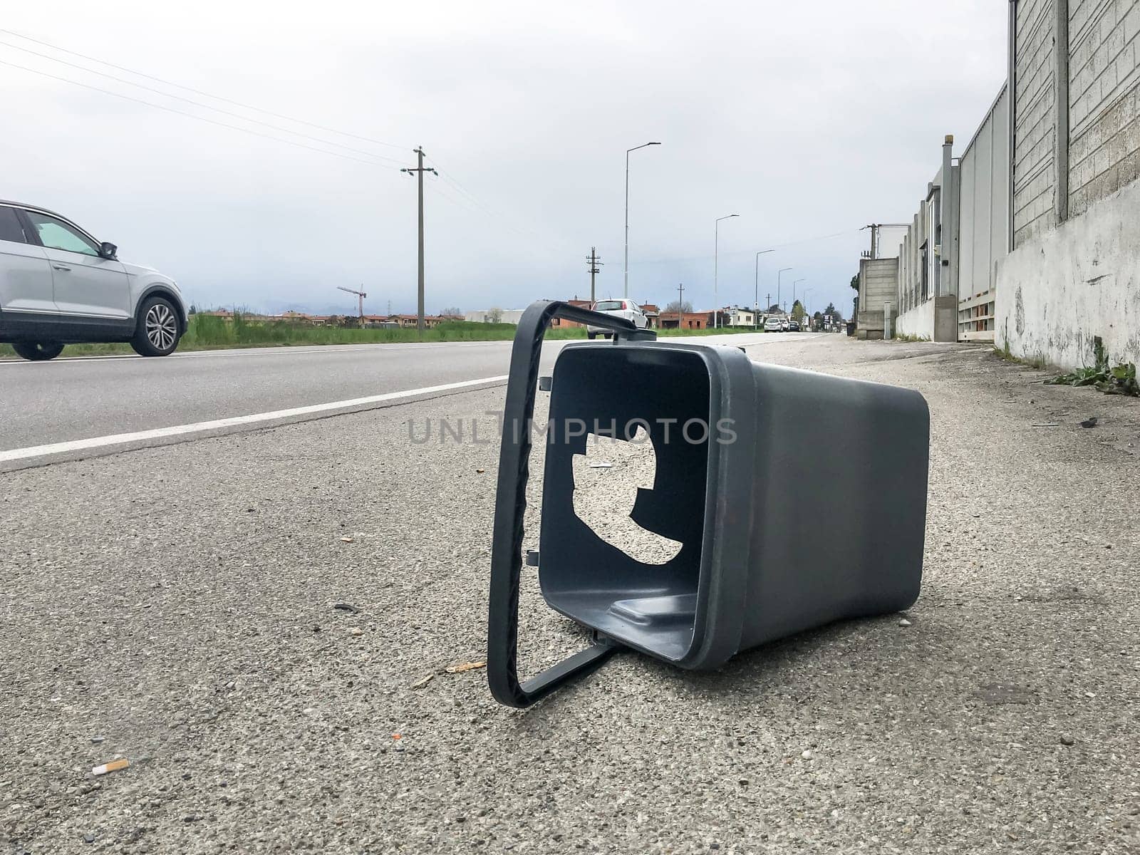 Bin that should be used for separate collection, abandoned as rubbish on the side of the road - concept.