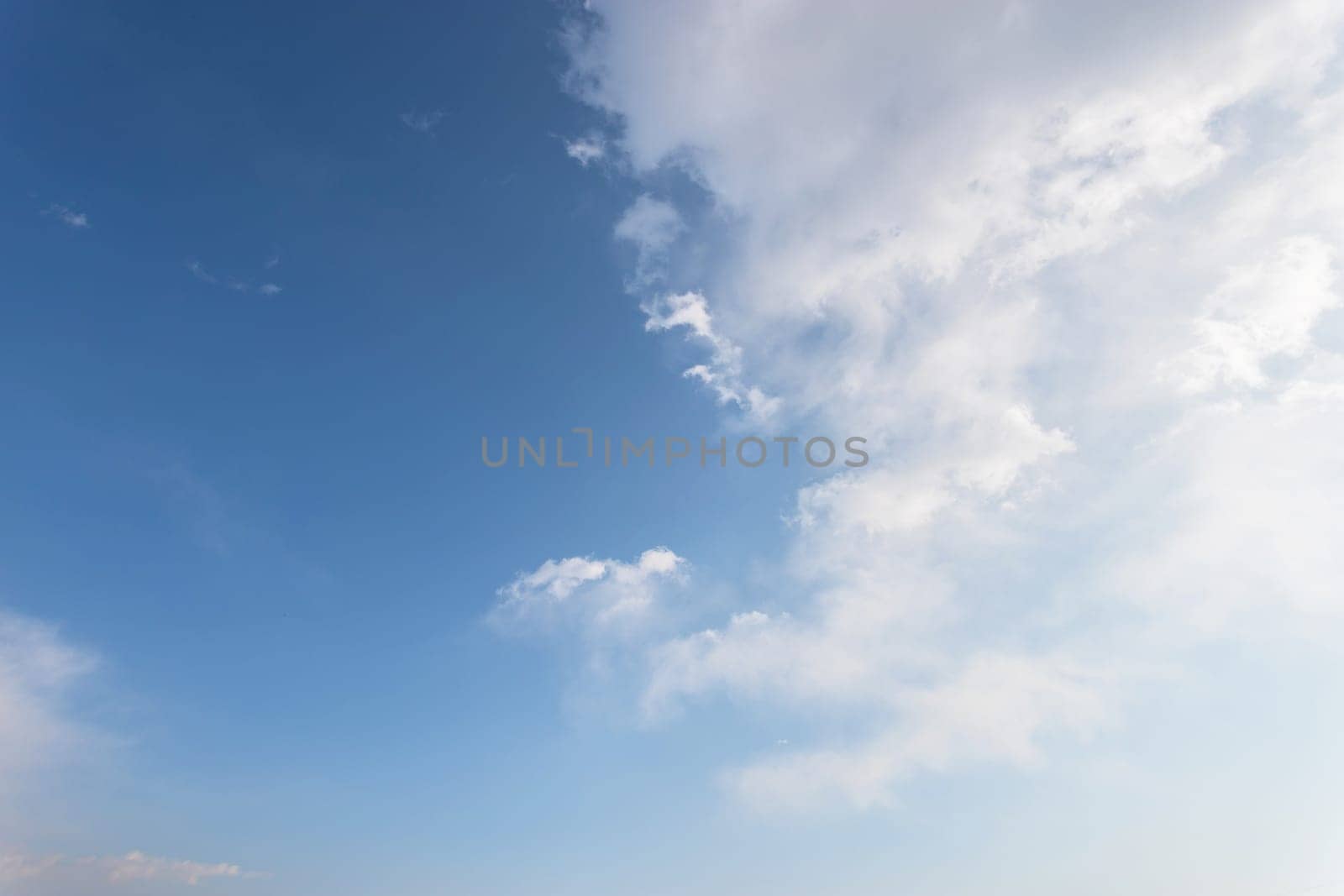 Blue sky with white clouds. Ideal for bakcgrounds and texture.