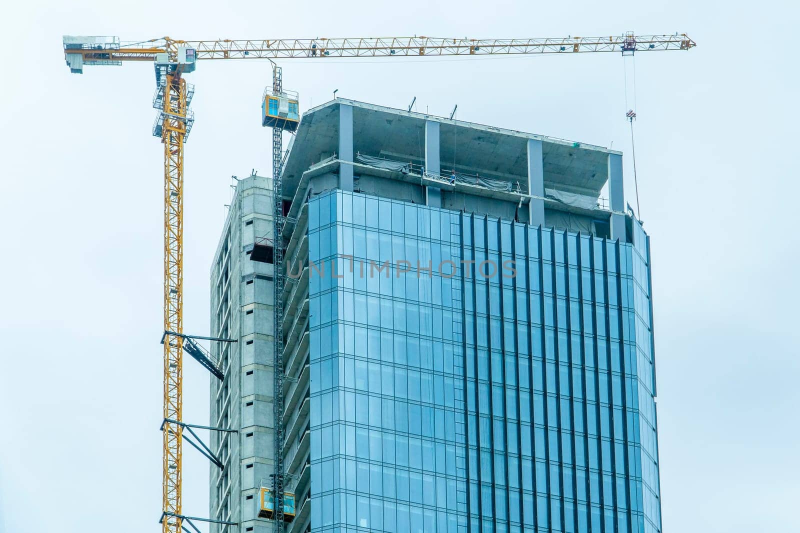 Building site with cranes and blue sky