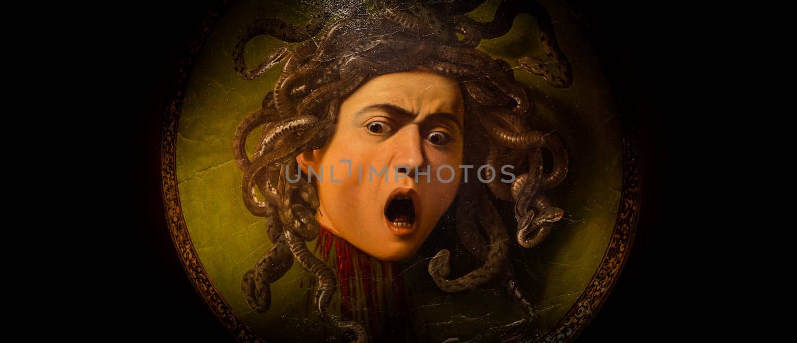 Florence, Italy - Circa August 2021: Medusa by Caravaggio, ca 1598 - oil on canvas