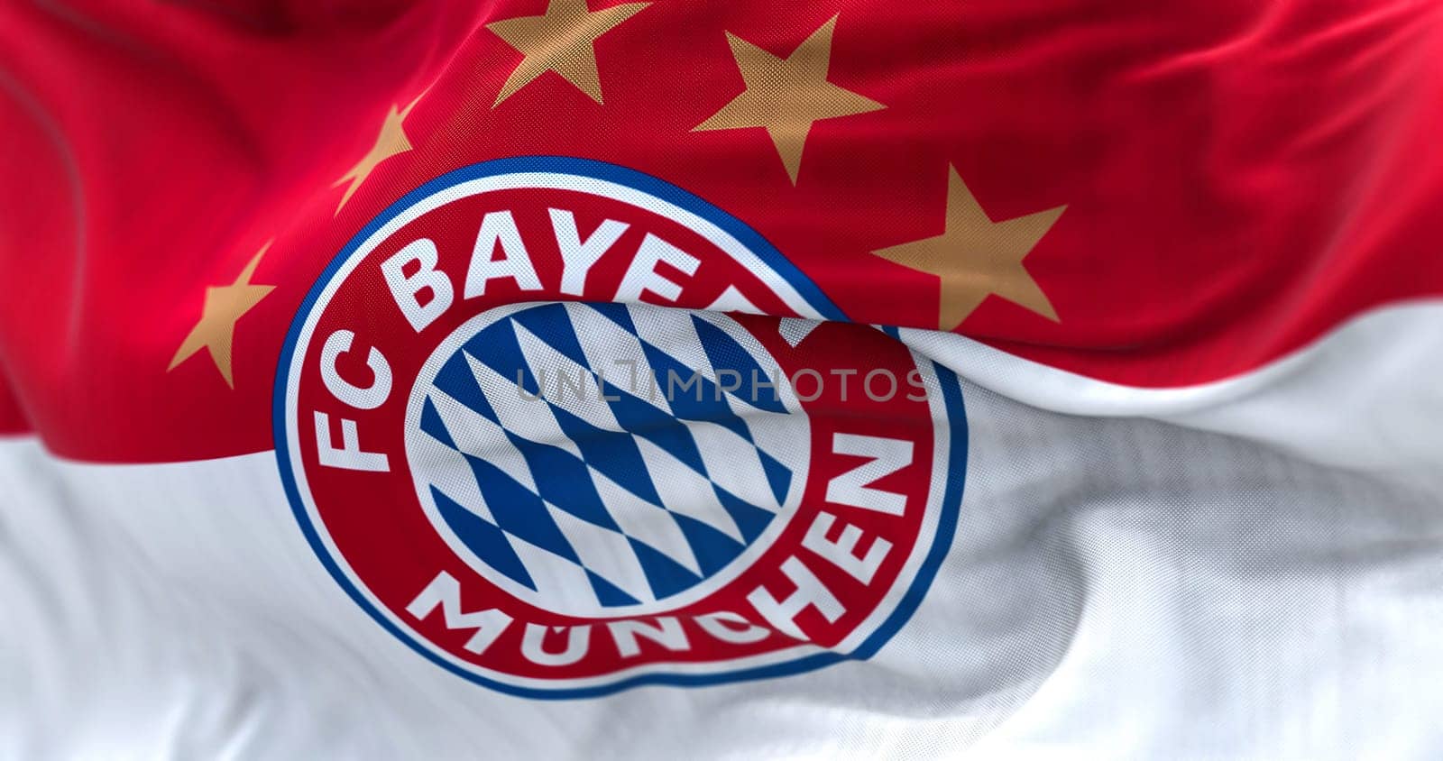 Munich, GER, June 2022: Fabric background with the Bayern Munich Flag waving. Bayern Munich is a German sports club based in Munich