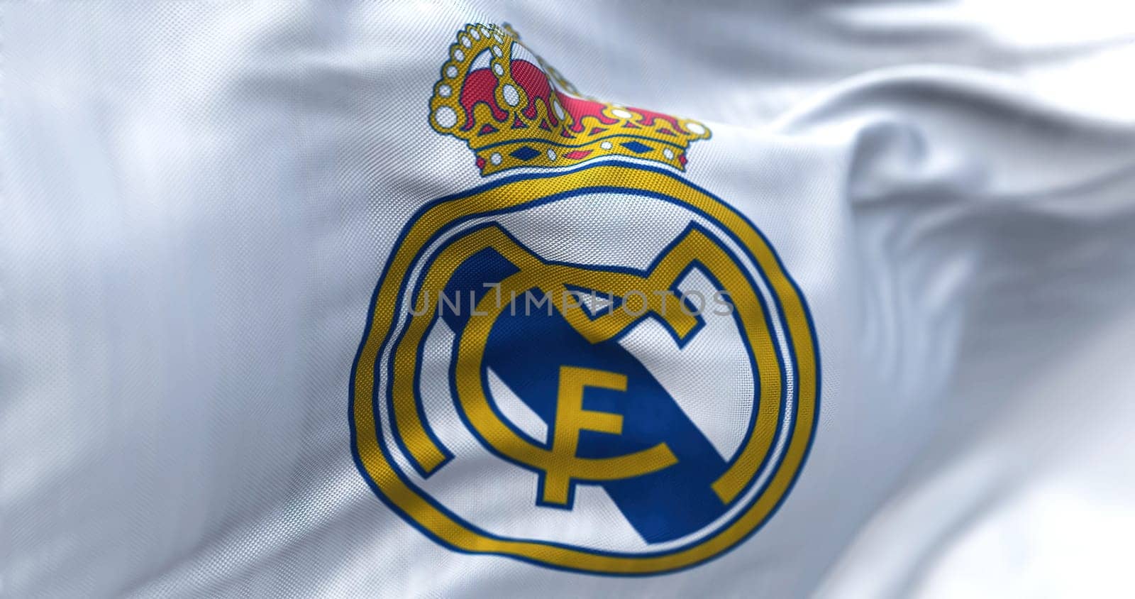 Madrid, Spain, May 2022: The flag of Real Madrid Club de Futbol waving in the wind on a clear day. Real Madrid C.F. is a Spanish professional football club based in Madrid. 3d illustration
