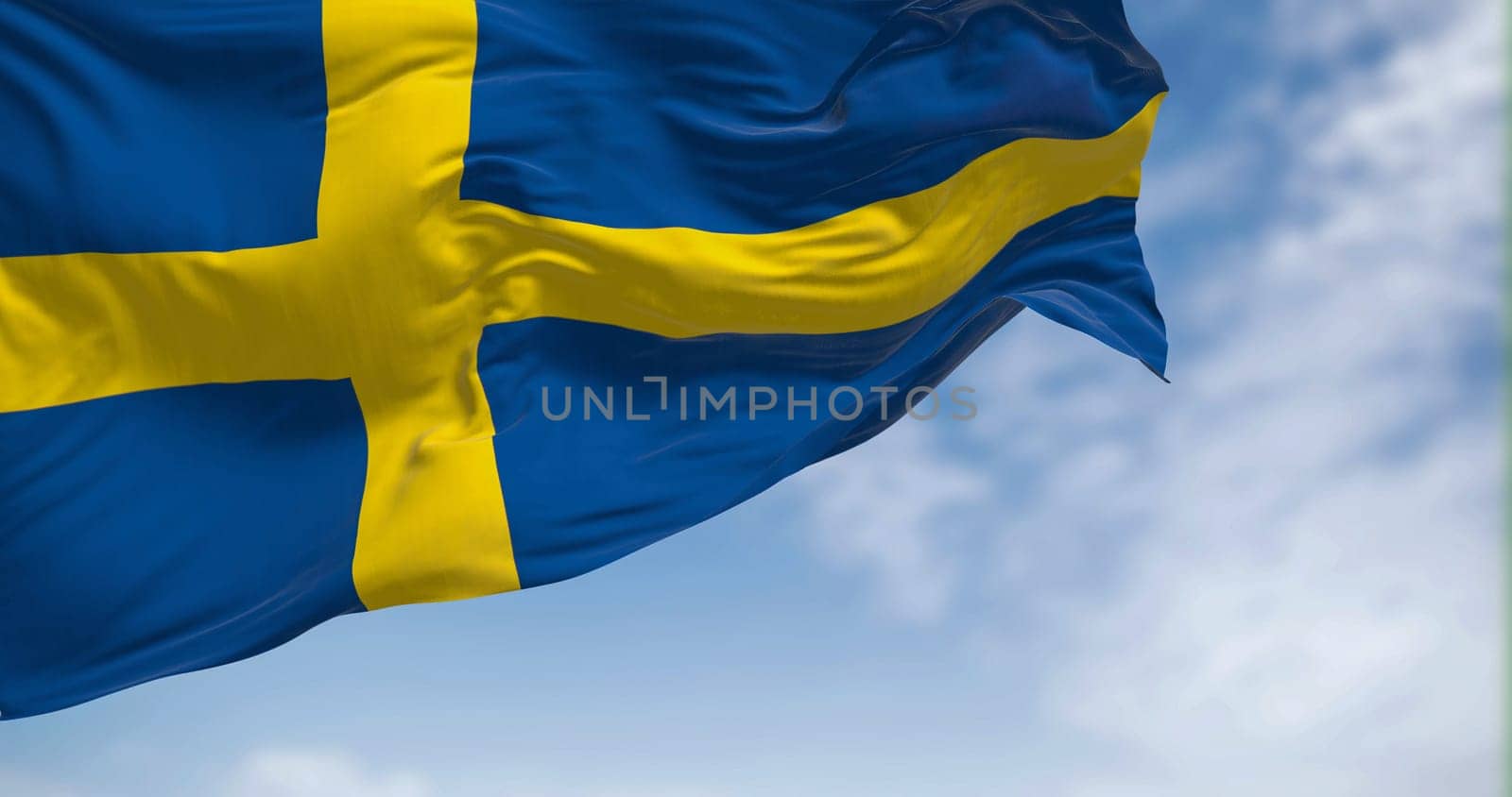 Sweden national flag waving in the wind. The Kingdom of Sweden is a Nordic country in Scandinavia. Selective focus. 3d illustration