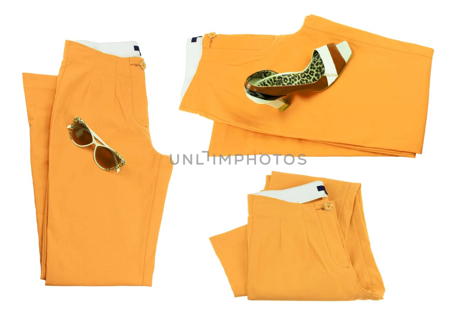 Collage woman clothes. Set of folded yellow elegant women trousers or denim pants with a matching of elegant single female high heeled shoe and sunglasses. Yellow fashion concept isolated.