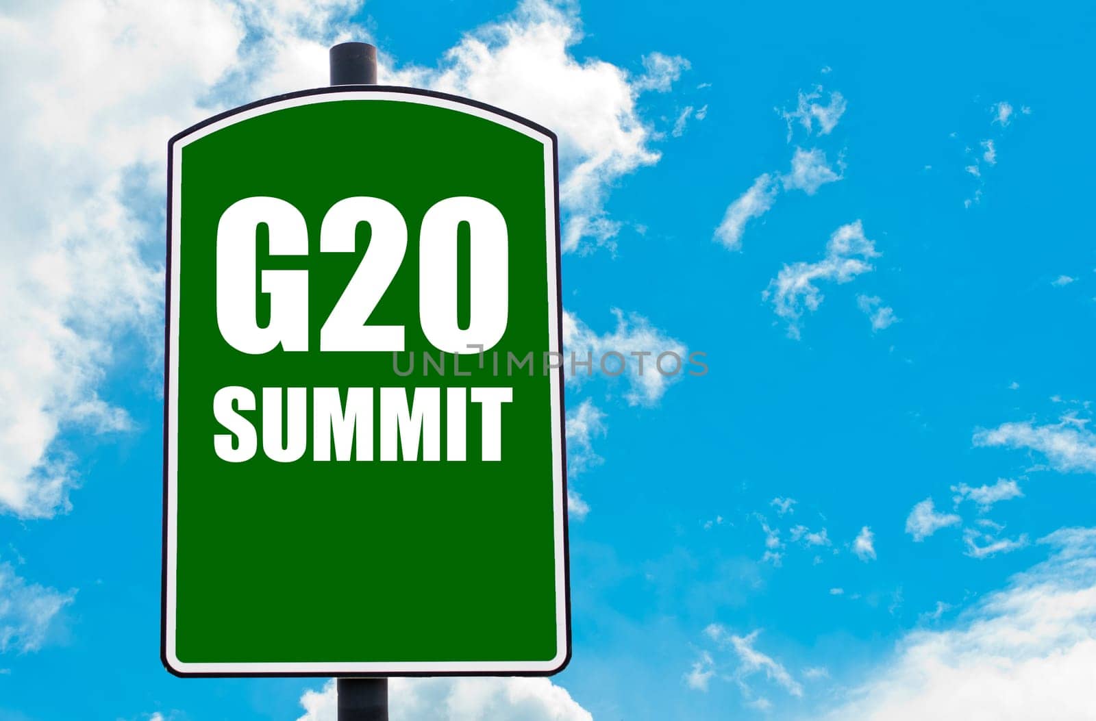 G20 SUMMIT written on green road sign  against clear blue sky background. Concept image with available copy space