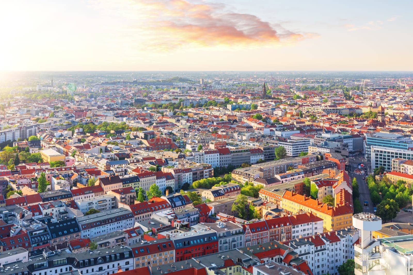 Sunset panorama of Berlin, colorful roofs of the city, Germany.