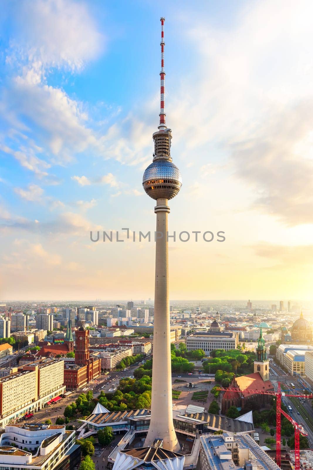 skyline panorama of Berlin with Red City Hall and TV Tower at sunset, Germany.