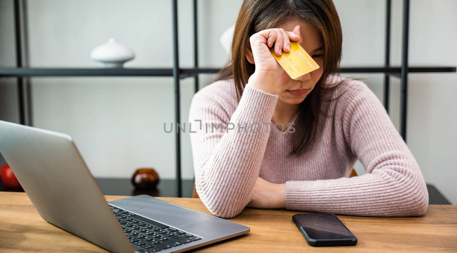 Stressed female hold credit card calculating monthly home expenses income is money not enough with laptop computer, Worried woman have problem with blocked creditcard rejected online payment