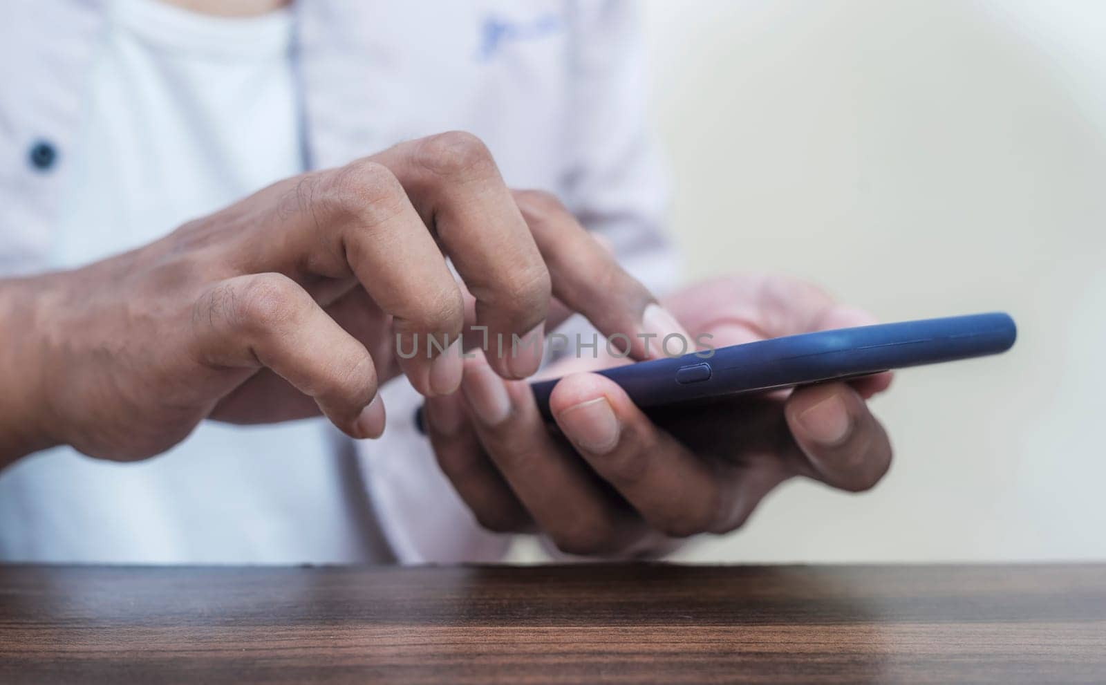 Business man using smartphone mobile blurred background, Age of technology People's, Use of technology in the modern era, Interconnection by internet network, Communication with the Internet