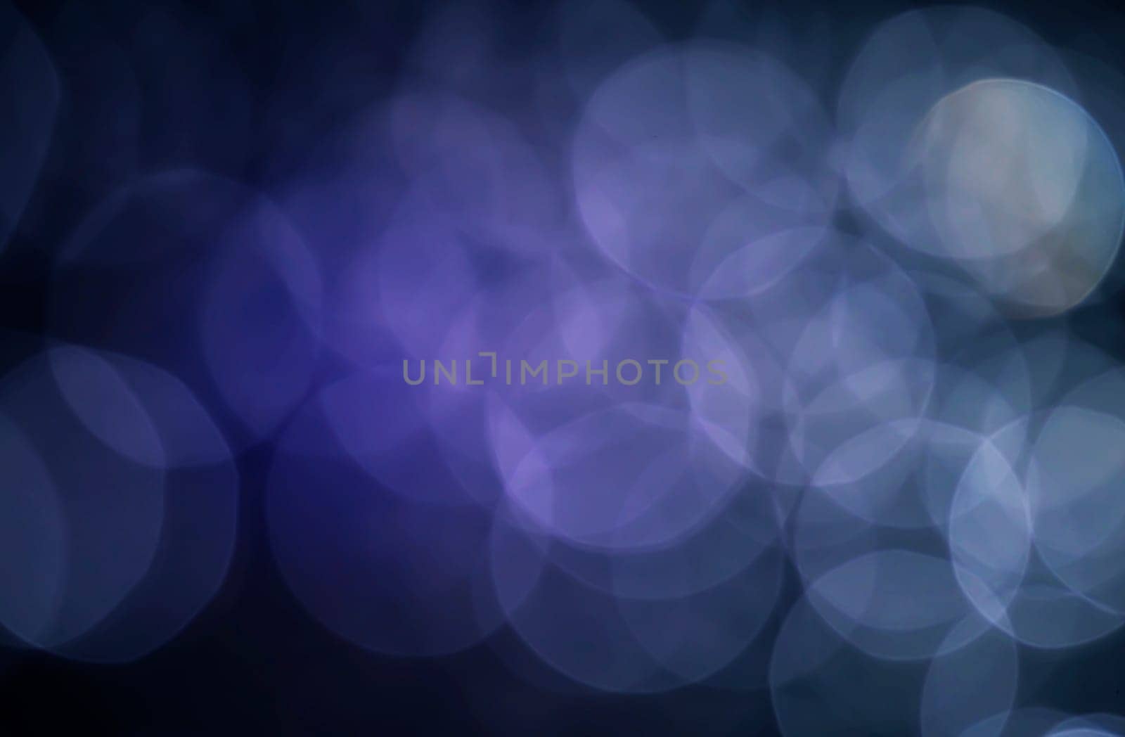 Light abstract dark bokeh christmas circle color glitter blurred black background