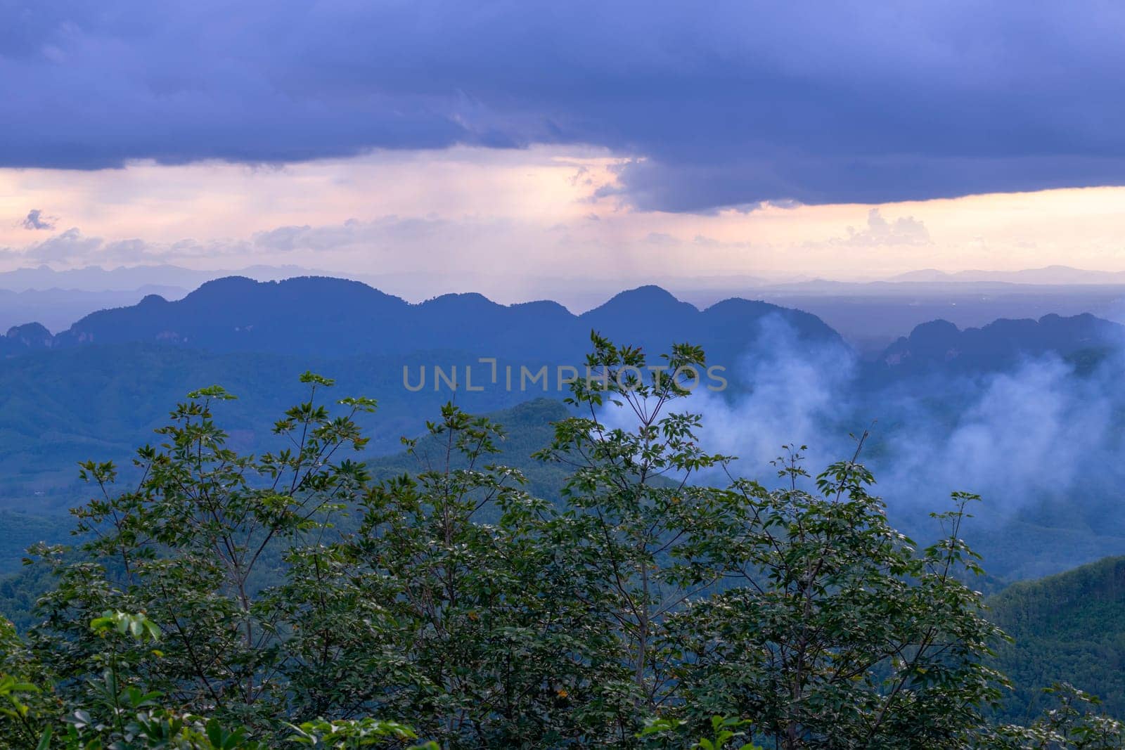 View of landscape nature and mist and mountain with sunlight and sunset or sunrise in morning light, Abstract and pattern of cloud sky Calming coral, Orange, Trend color of the year background