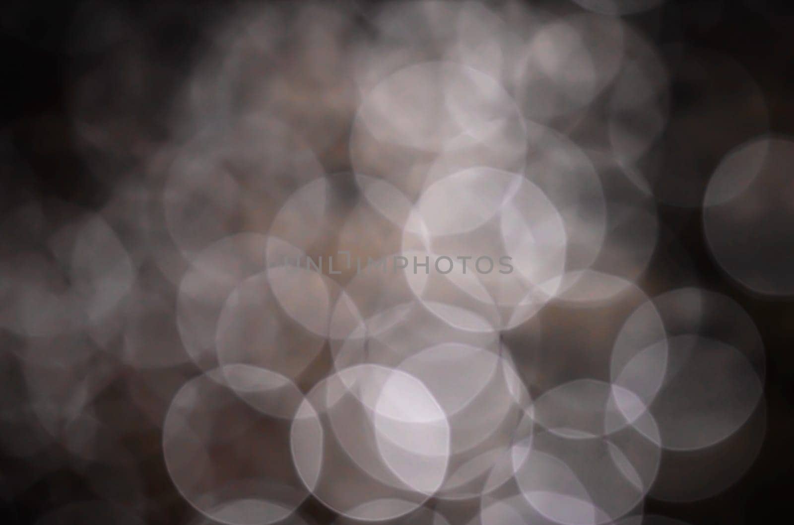 Light abstract dark bokeh christmas circle color glitter blurred black background