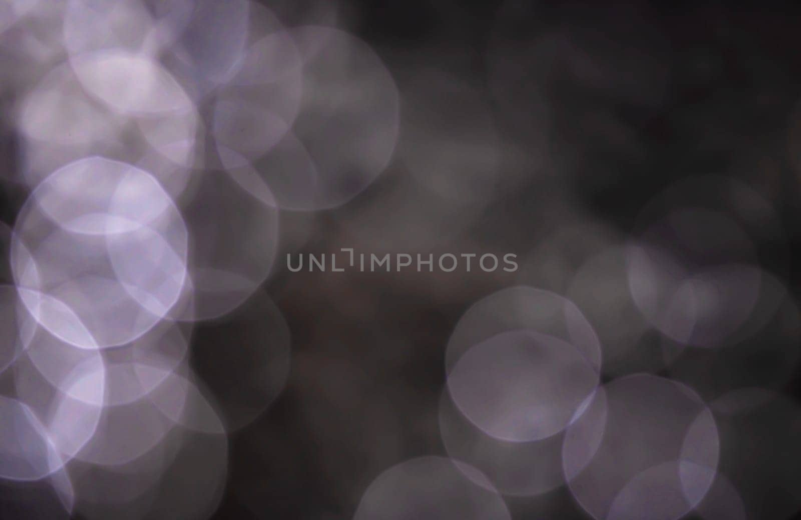 Light abstract dark bokeh christmas circle color glitter blurred black background