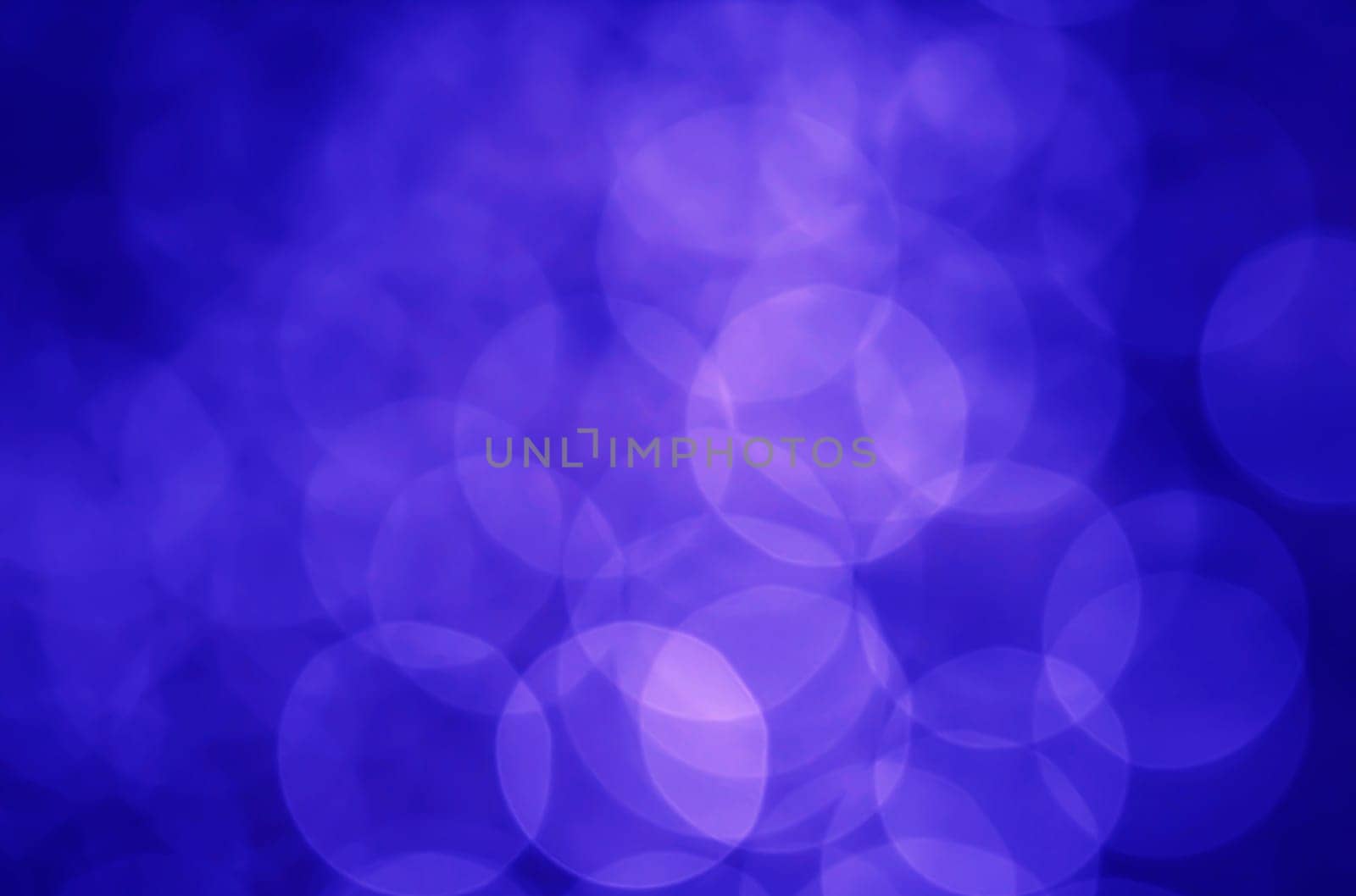 Light abstract dark bokeh christmas circle color glitter blurred black background