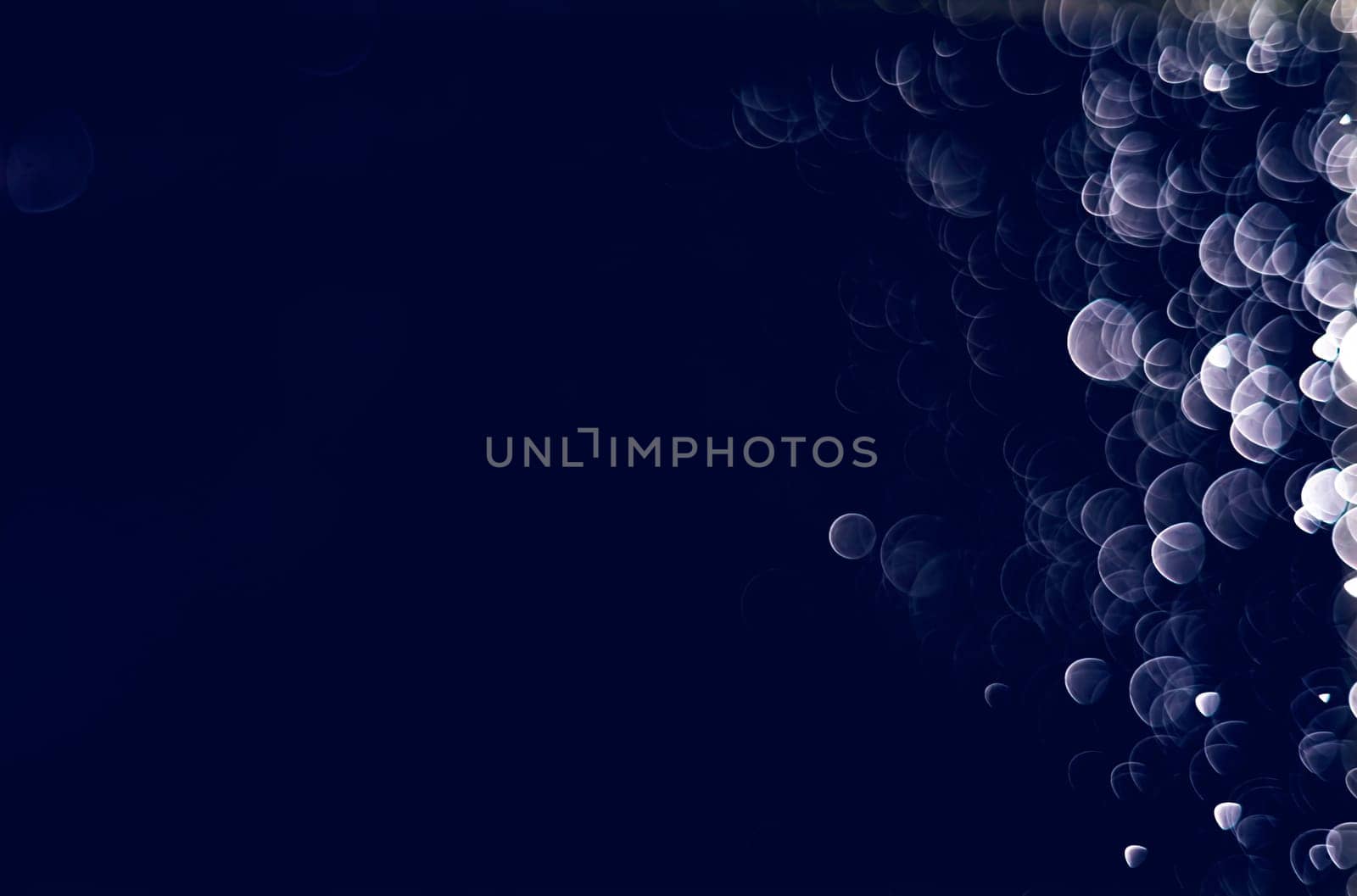Light abstract dark bokeh christmas circle color glitter blurred black background