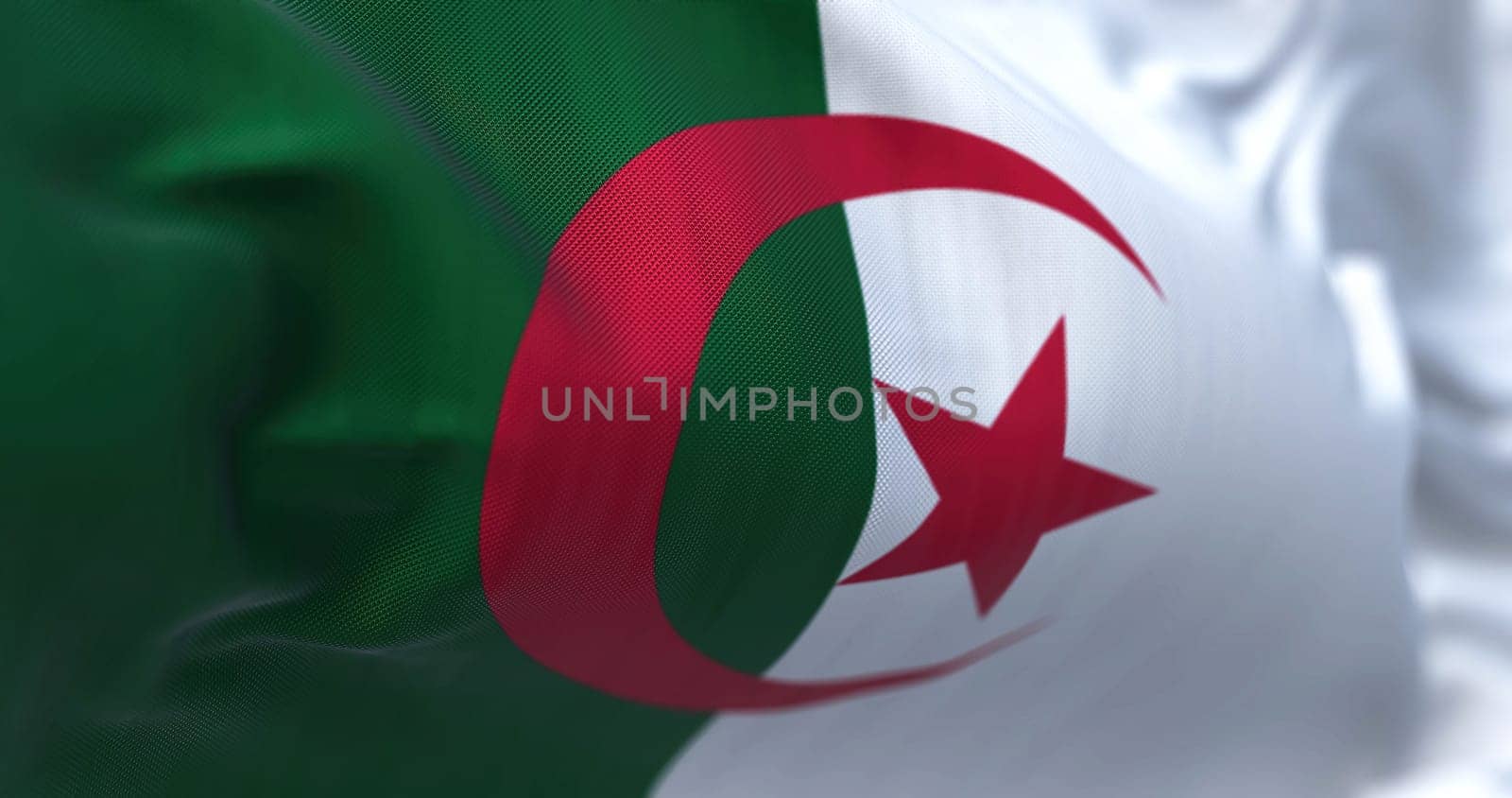 Close-up view of the Algeria national flag waving in the wind. People Democratic Republic of Algeria, is a country in North Africa. Fabric textured background. Selective focus. Realistic 3D illustration