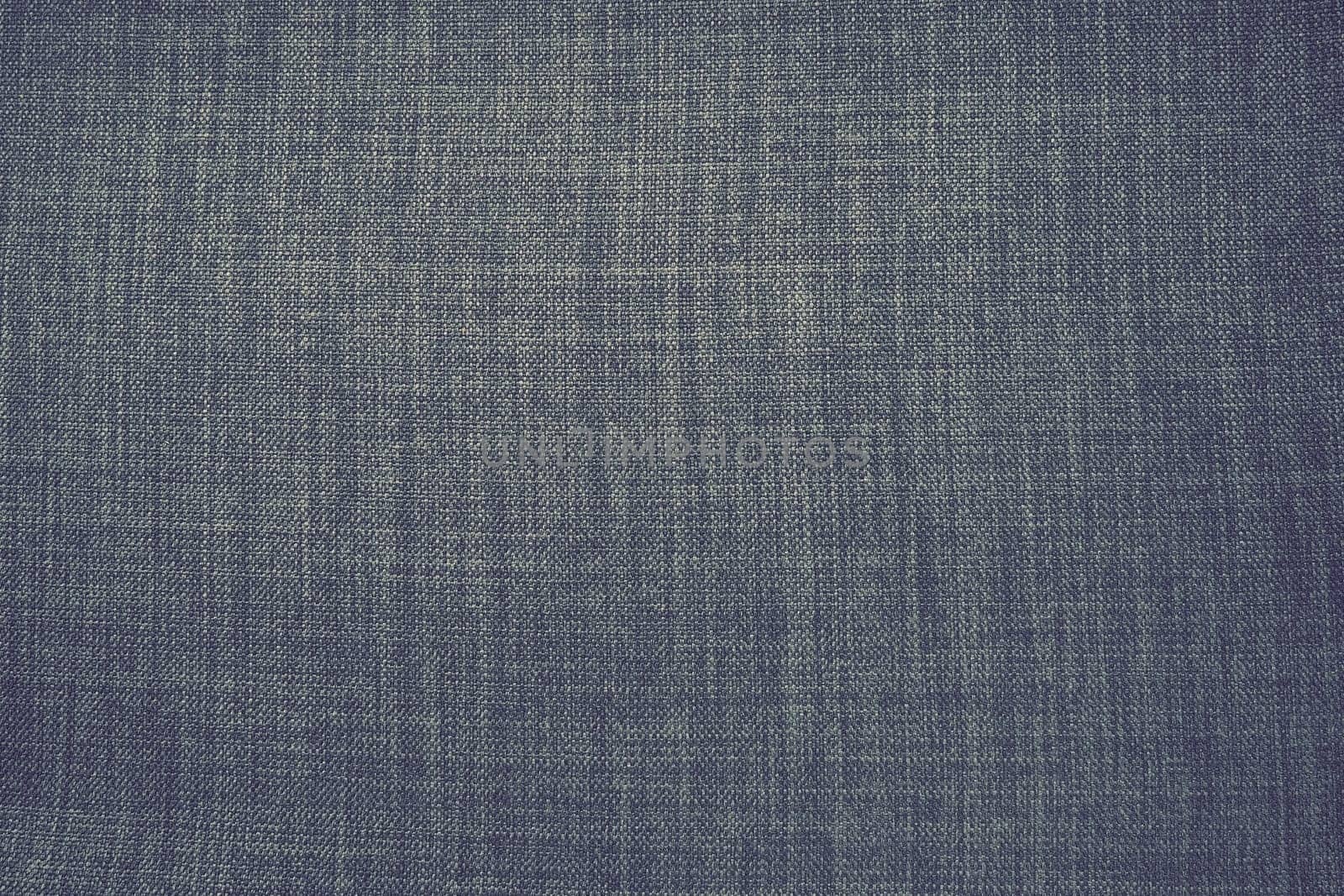 gray background fabric texture. A piece of woolen cloth is neatly laid out on the surface. Weave and textile texture. Dress fabric or for kitchen needs, tablecloth or curtains, close-up. Dash.