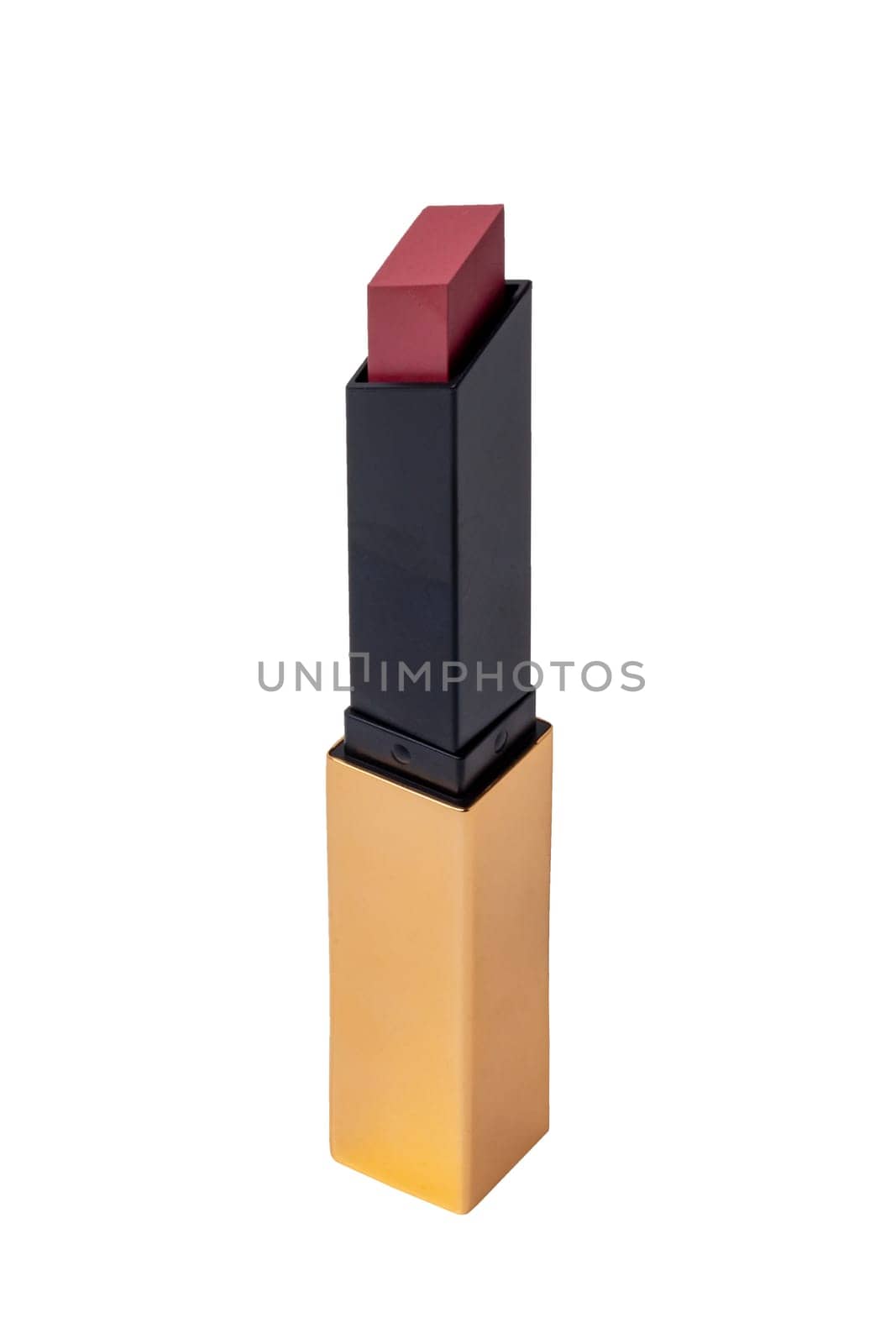 Lipstick isolated. Closeup of a elegant gold yellow lipstick isolated on a white background. Make-up and beauty concept. Clipping path. Macro.