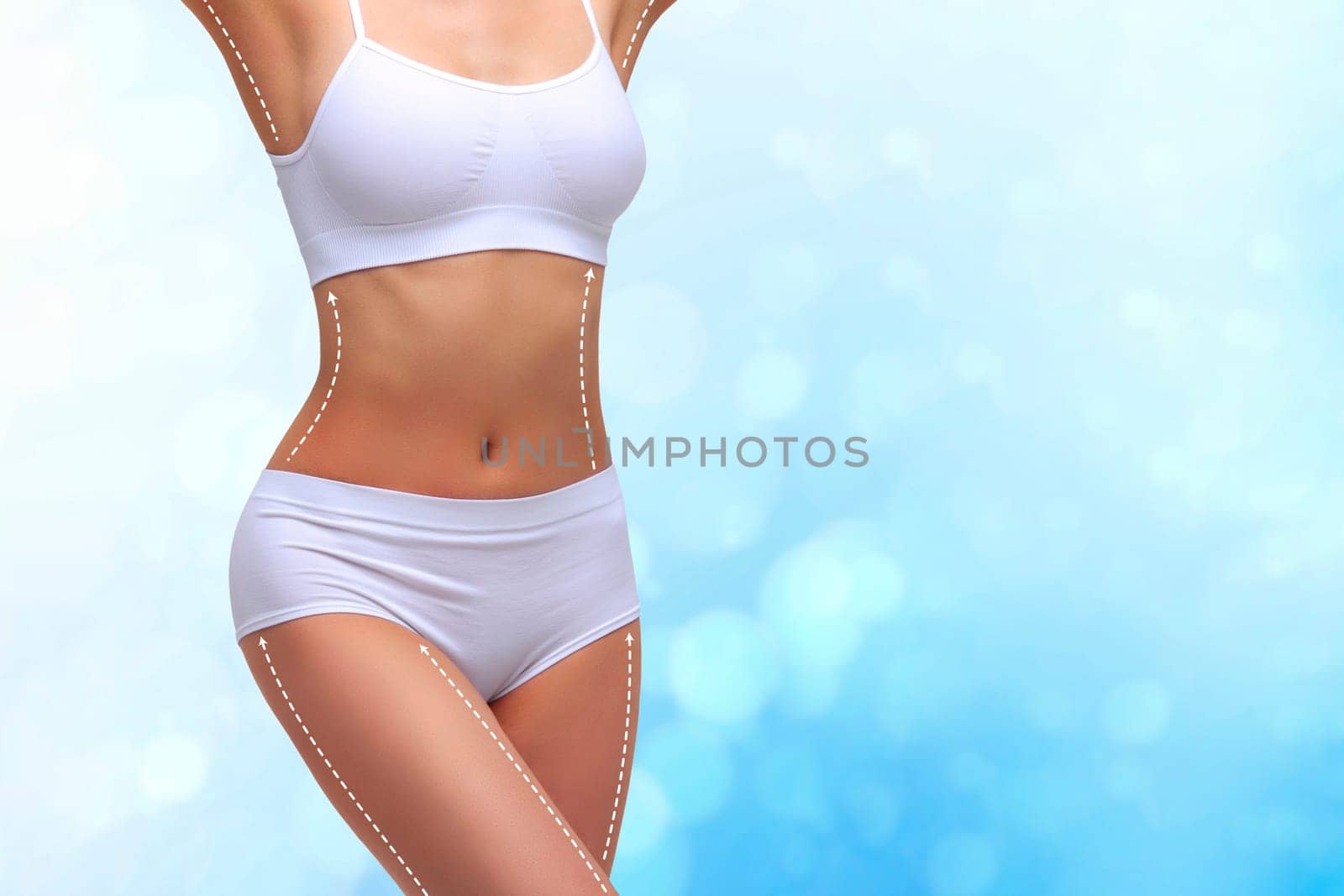 Dotted lines on beautiful female body. Closeup of woman slim fit body with white marks