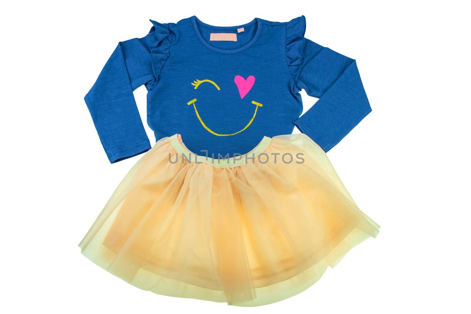 Children clothes. Fashionable festive yellow short summer skirt and a long sleeved blue shirt for the little girl isolated on white. Clipping path. Ballerina kids clothing.