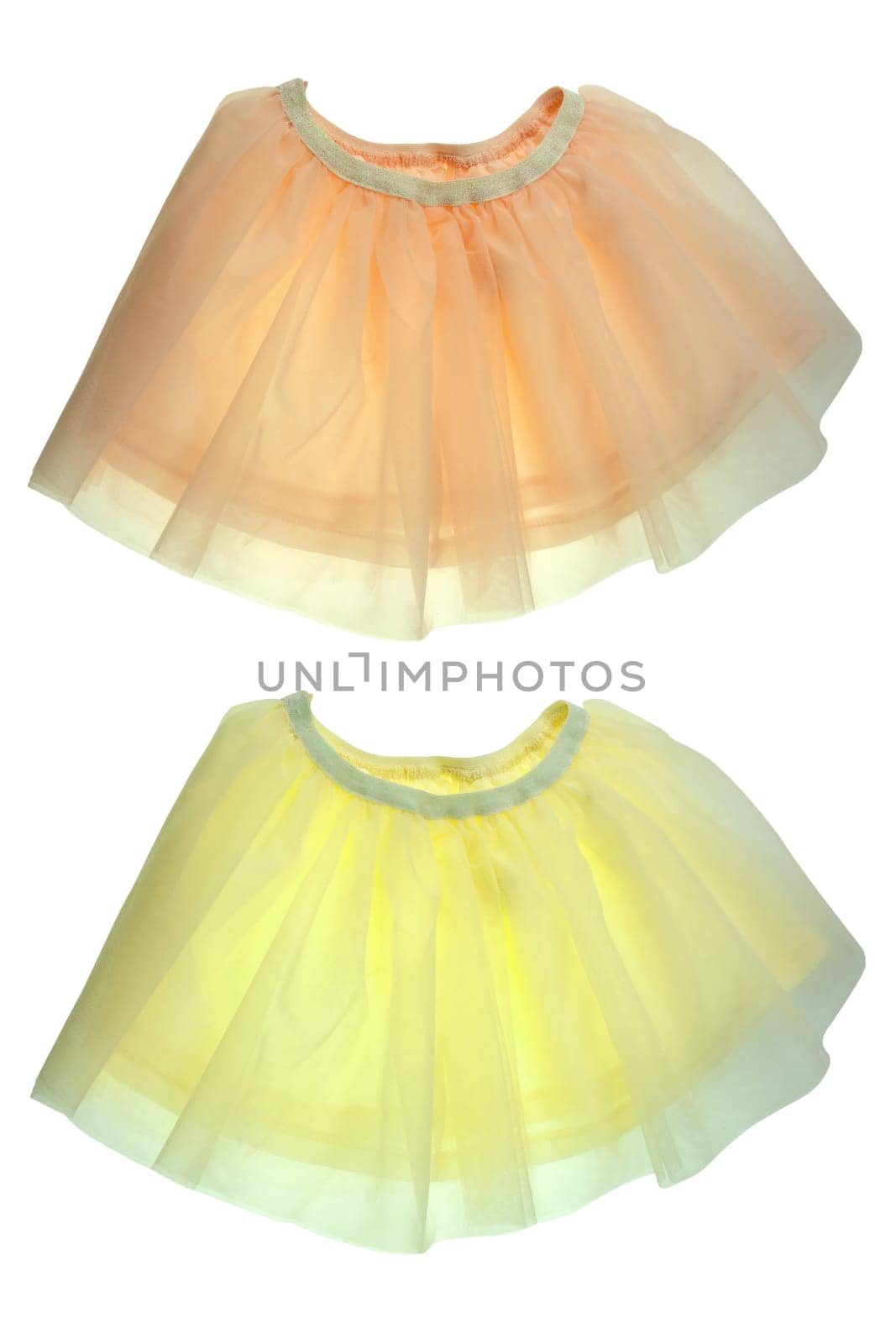 Children clothes. Fashionable festive short summer skirt in two pastel colors for little girl isolated on a white background. Clipping path. Ballerina kids clothing.