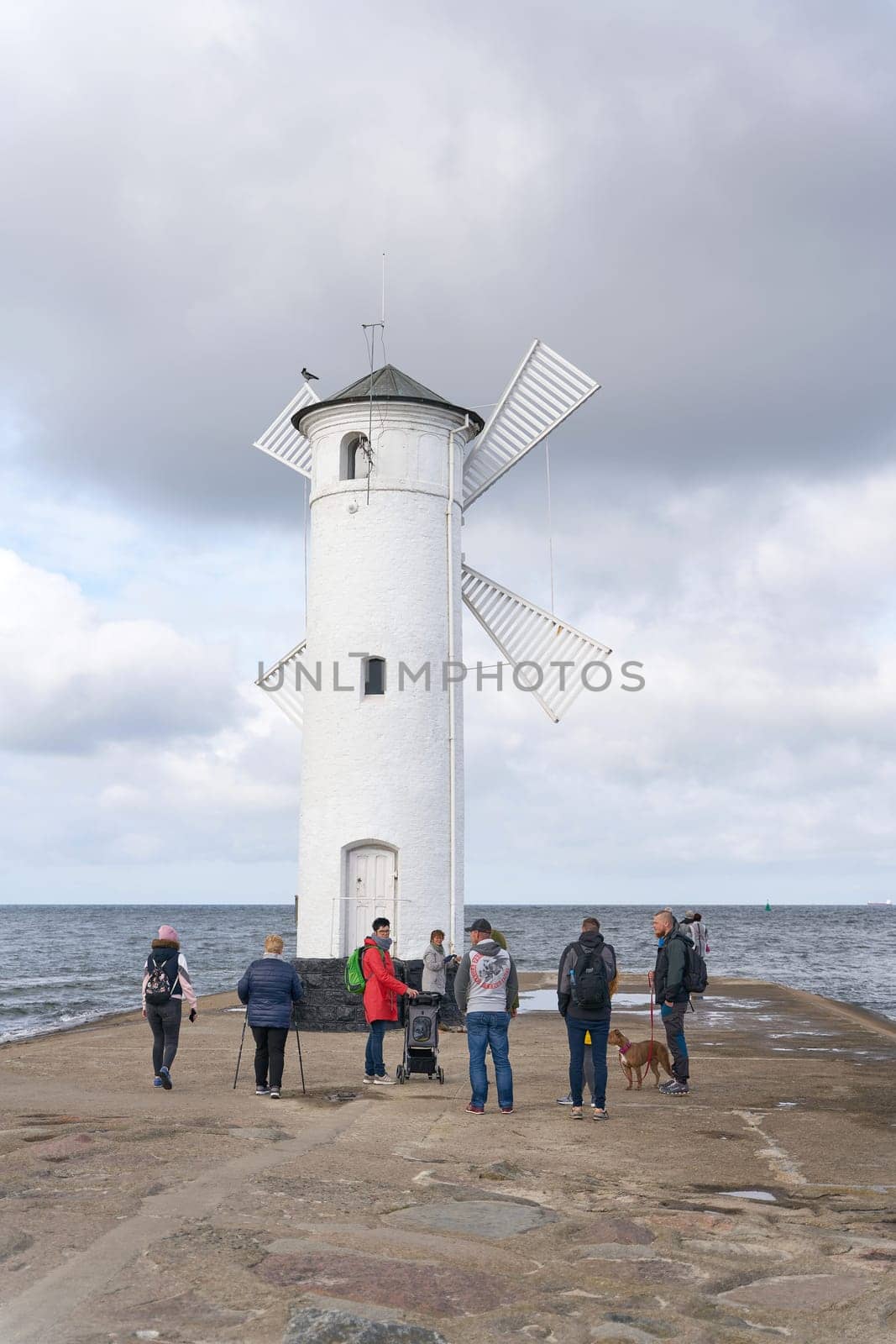Holidaymakers at the Muhlenbake, the landmark of Swinoujscie on the Polish Baltic coast