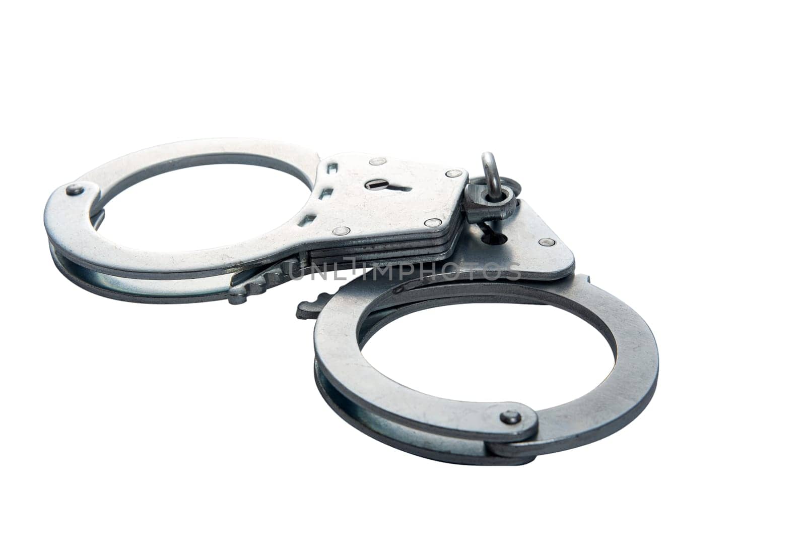 Metal handcuffs on a white isolated background, copy space. High quality photo