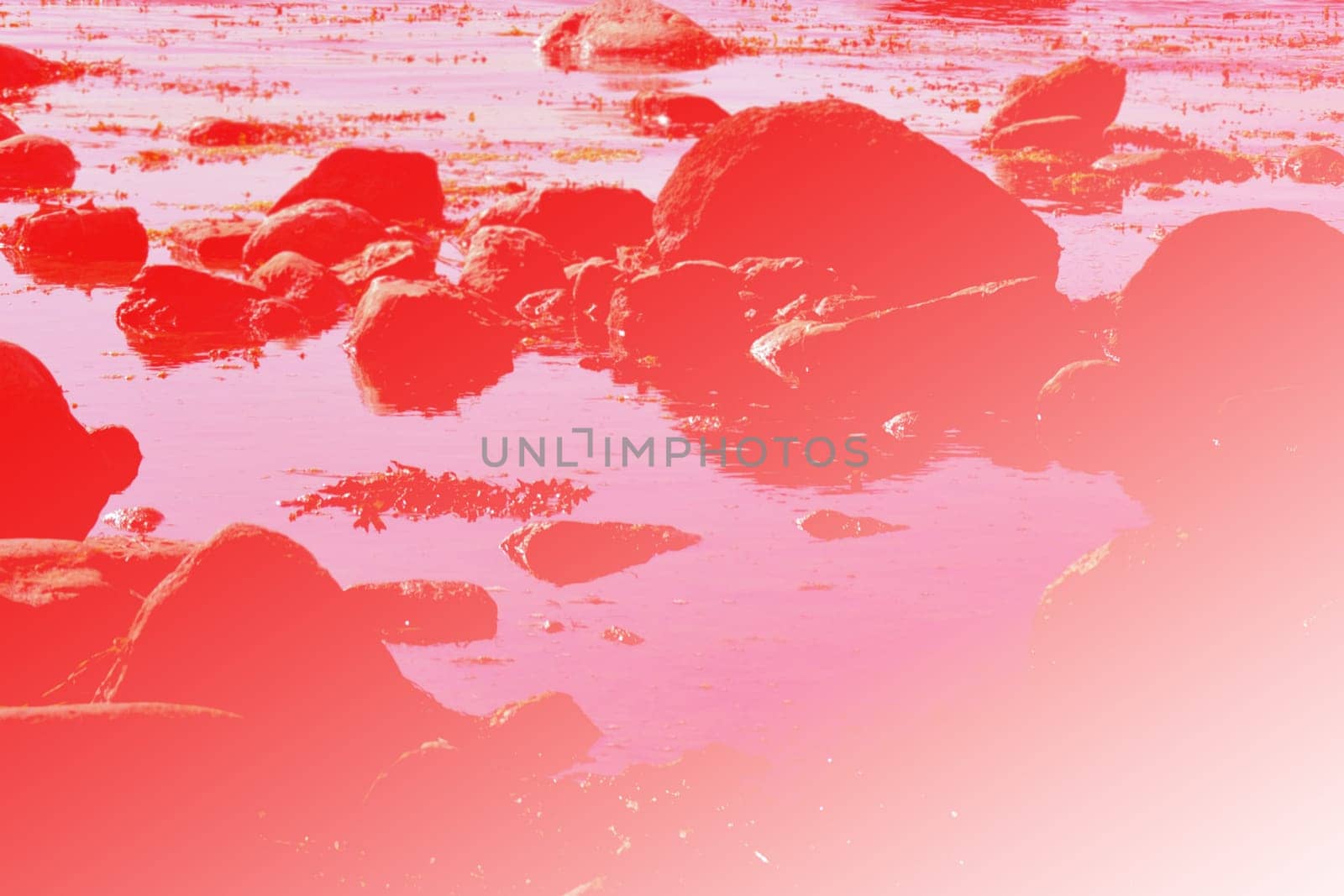 Abstract blurred stones and water in red