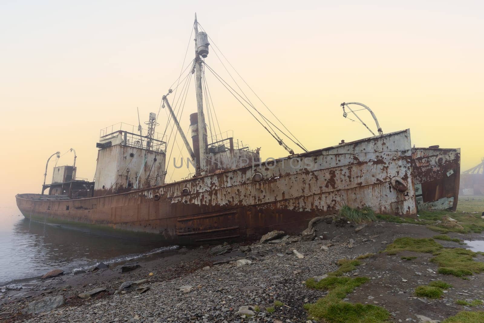 Old, rusty whaling ships and processing facilities at a now abandoned whaling station in Grytviken -on the island of South Georgia.