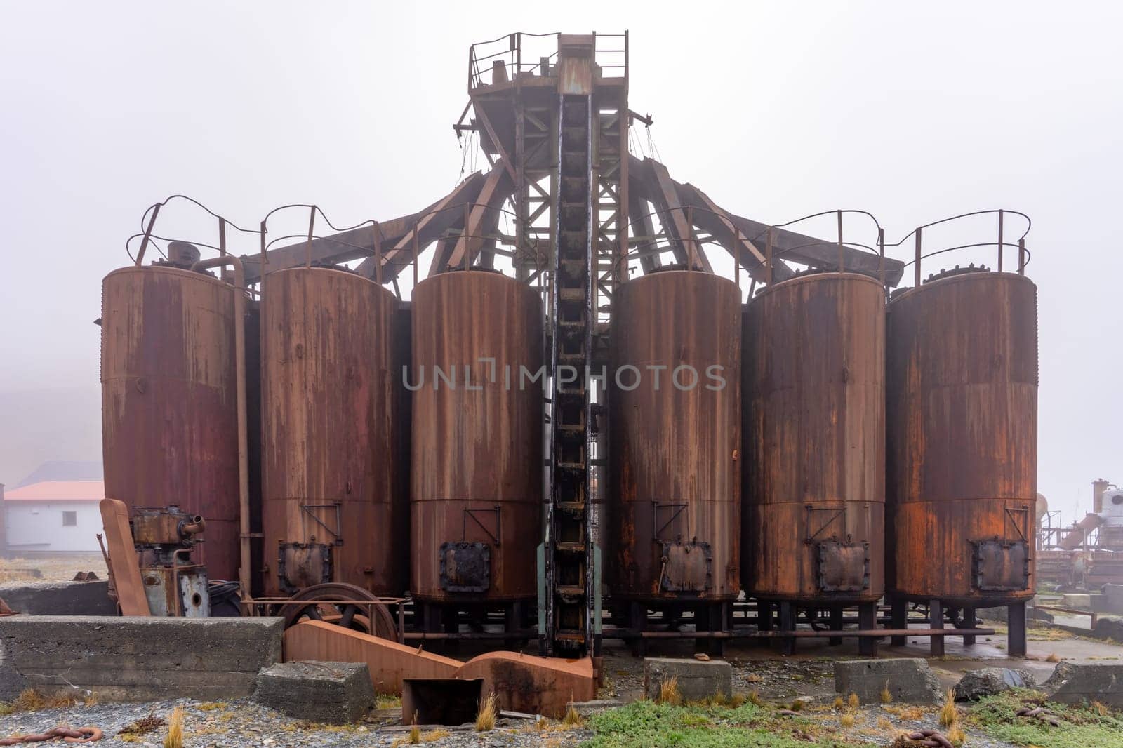 Old, rusty whaling ships and processing facilities at a now abandoned whaling station in Grytviken -on the island of South Georgia.