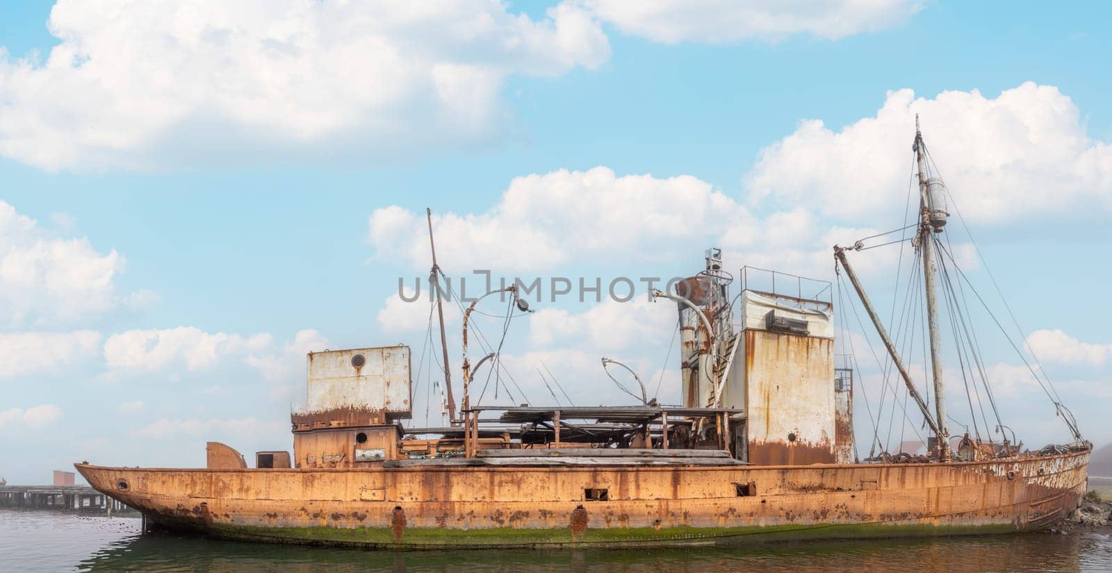Old, rusty whaling ships and processing facilities at a now abandoned whaling station in Grytviken -on the island of South Georgia.