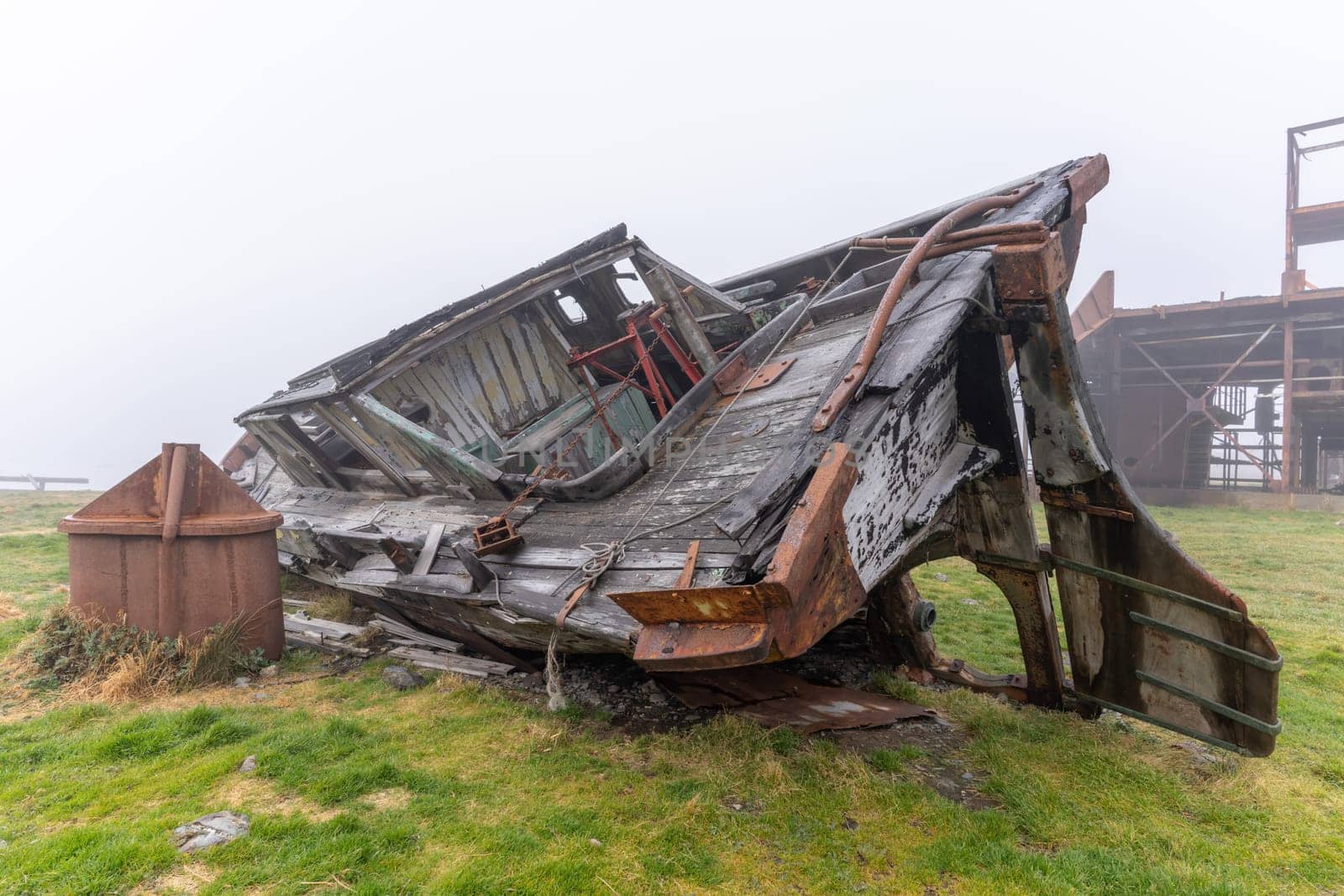 Old, rusty whaling ships and processing facilities at a now abandoned whaling station in Grytviken -on the island of South Georgia.