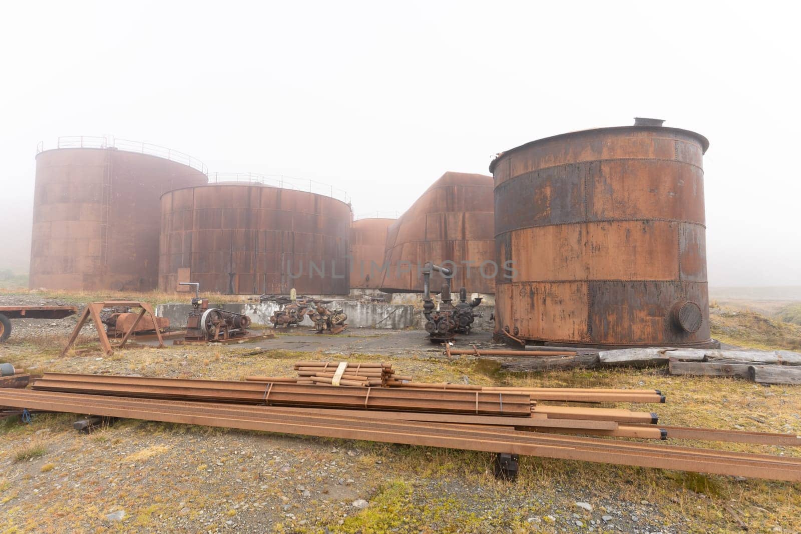 Old, rusty whaling ships and processing facilities at a now abandoned whaling station in Grytviken -on the island of South Georgia.