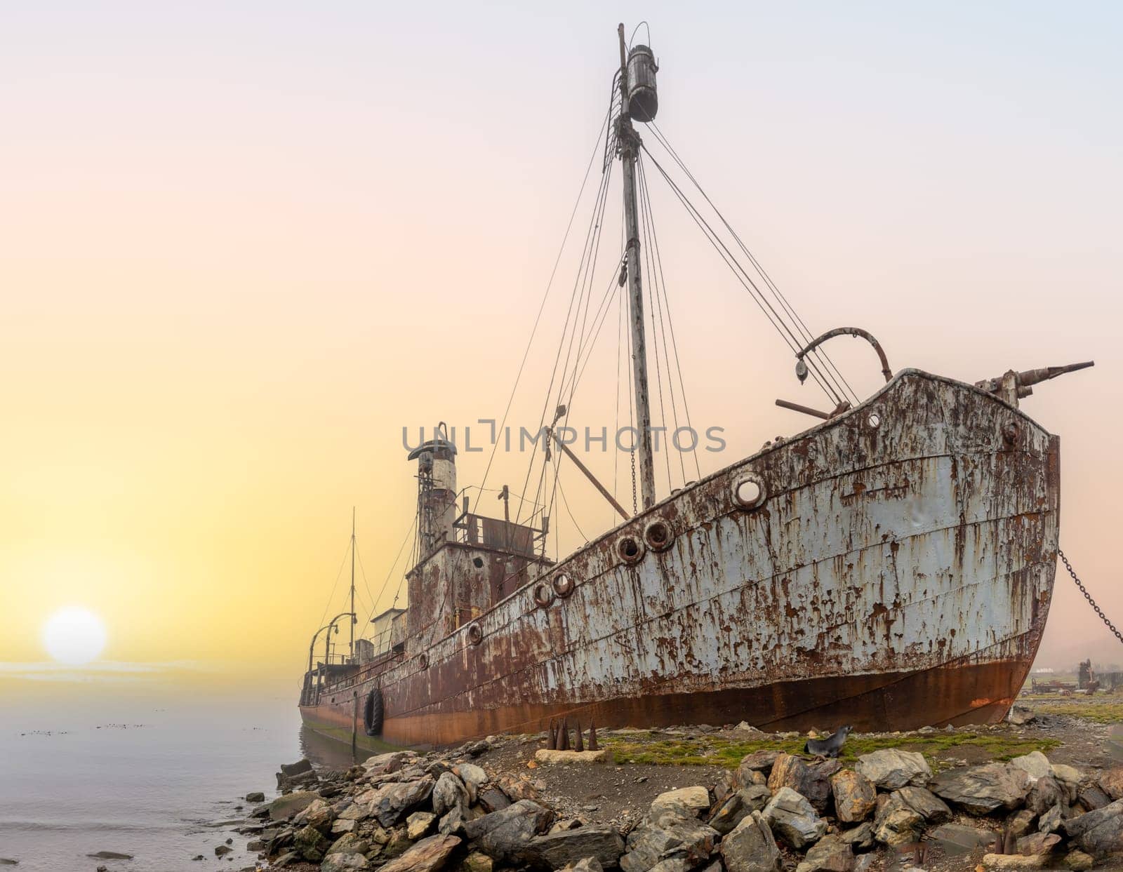 Old, rusty whaling ships and processing facilities at a now abandoned whaling station in Grytviken -on the island of South Georgia.