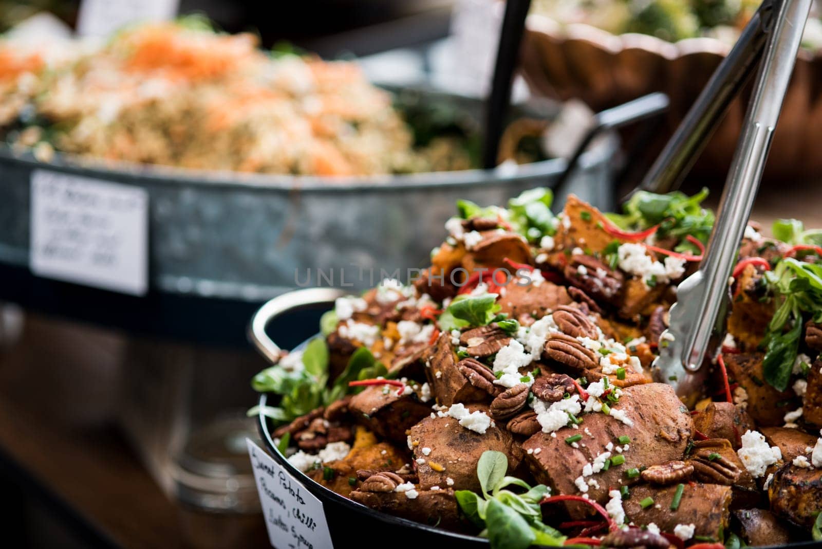 Selection of salads in the restaurant, close up.